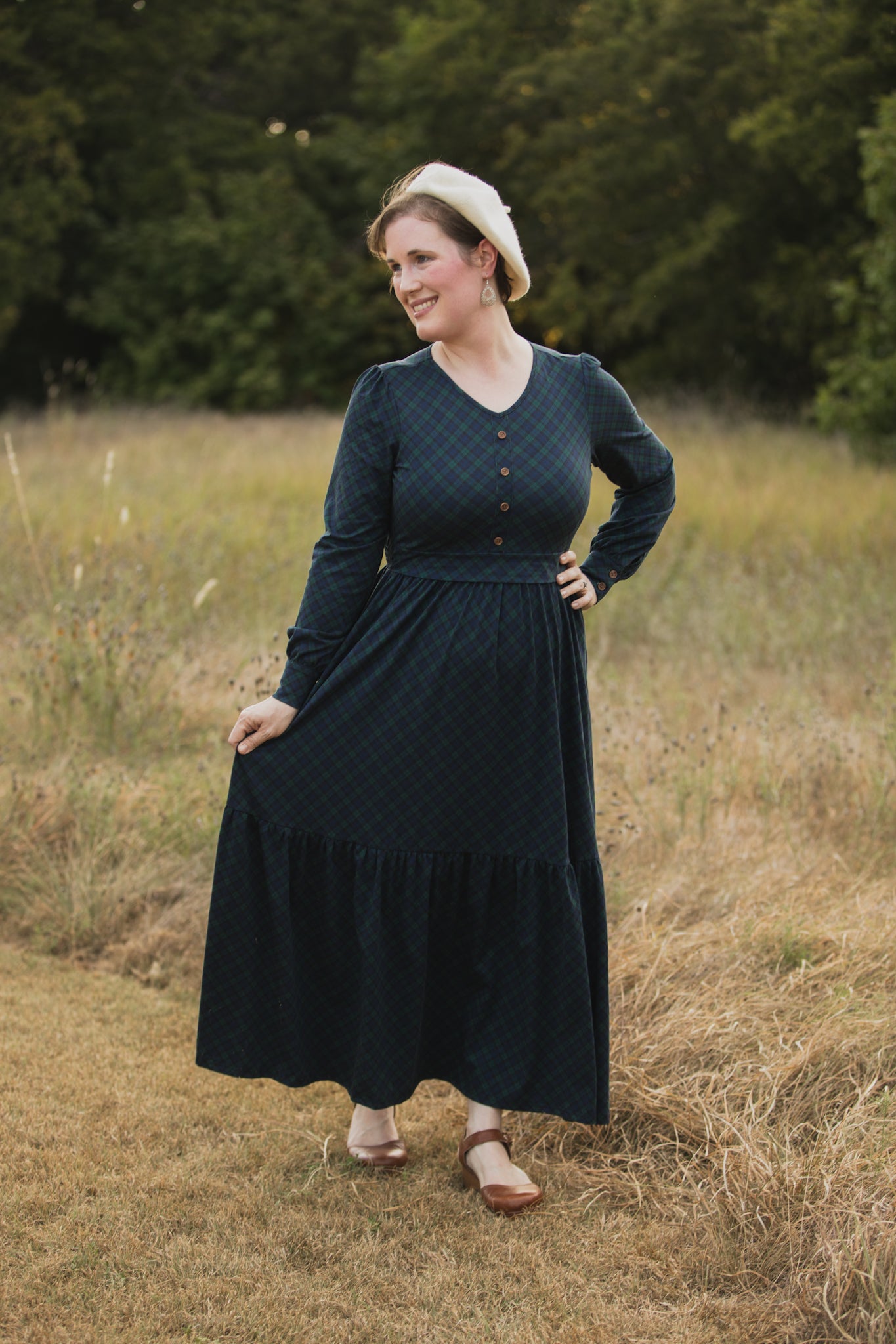 Woman in modest nursing dark blue dress field