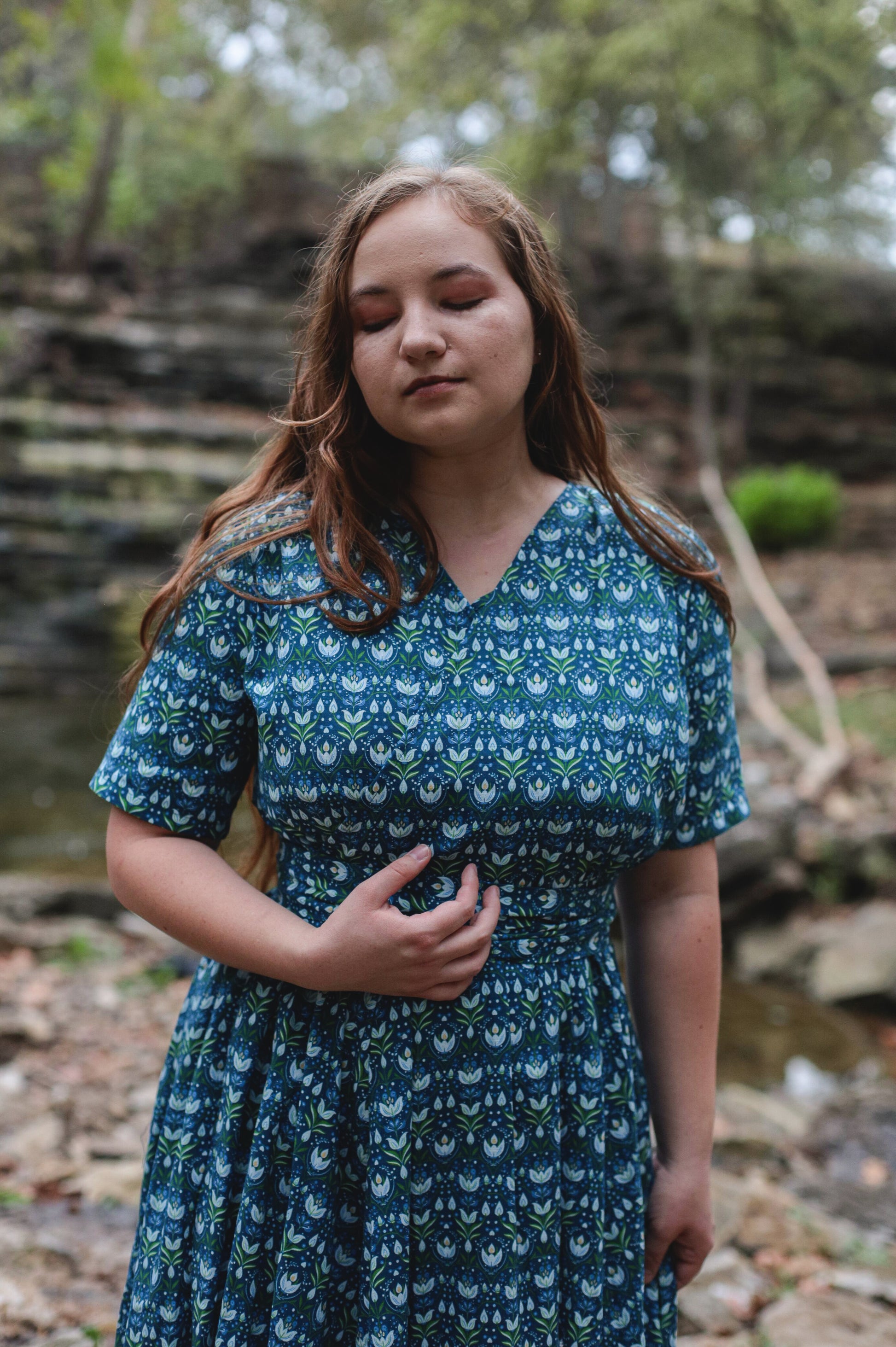 Woman in modest nursing dress outdoors