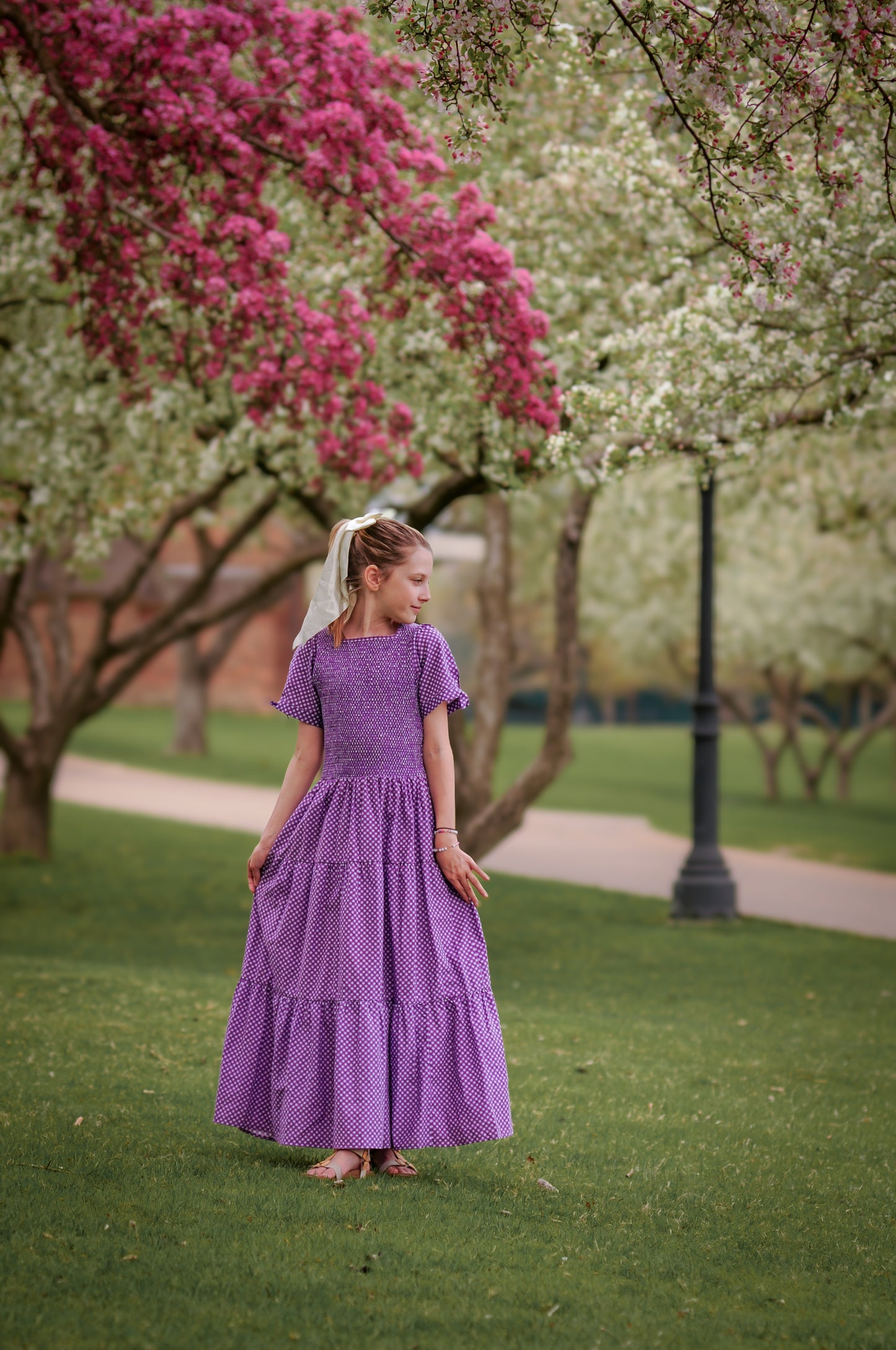 Young girl wearing a modest purple dress