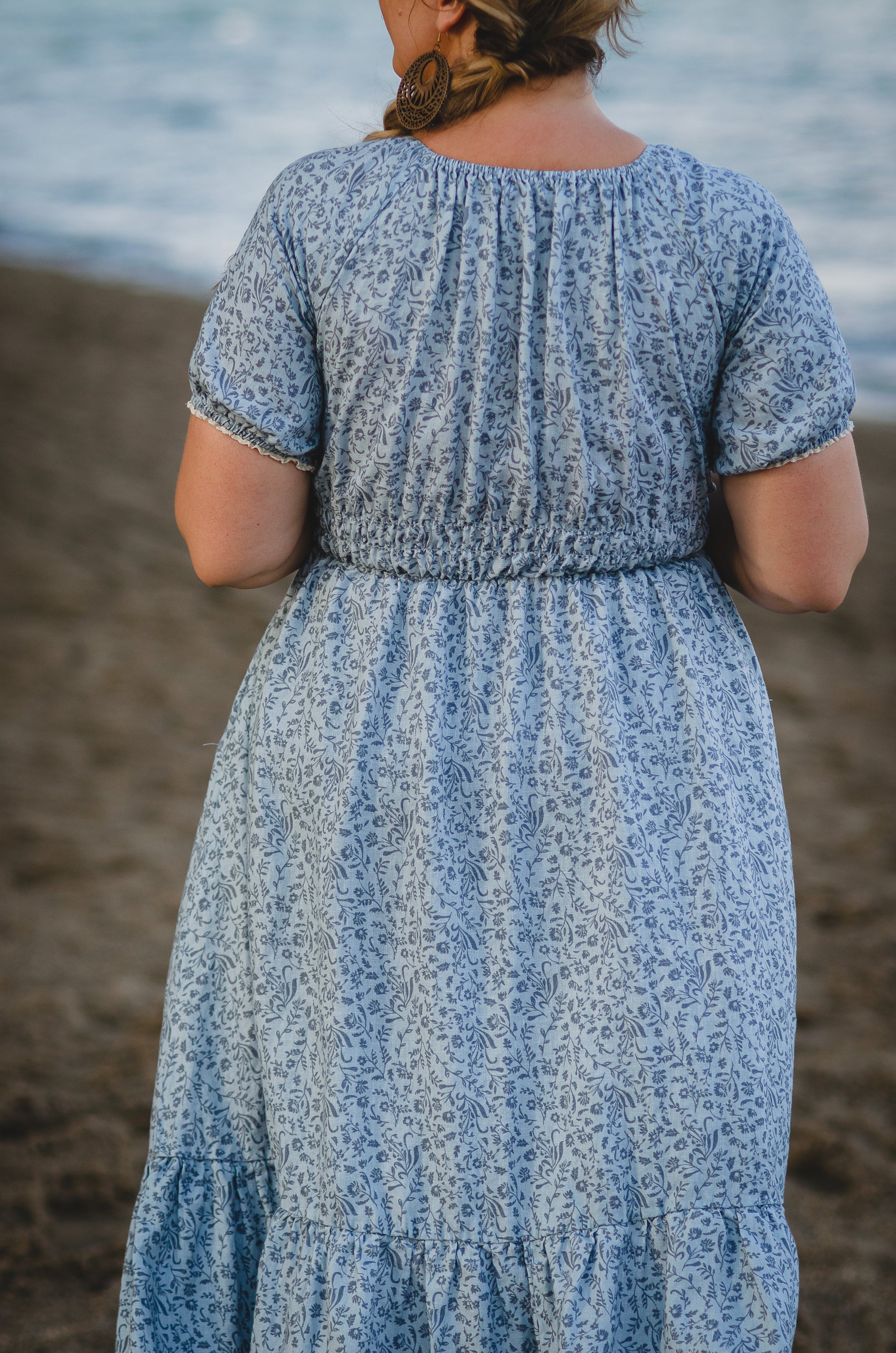 woman in a modest blue nursing dress