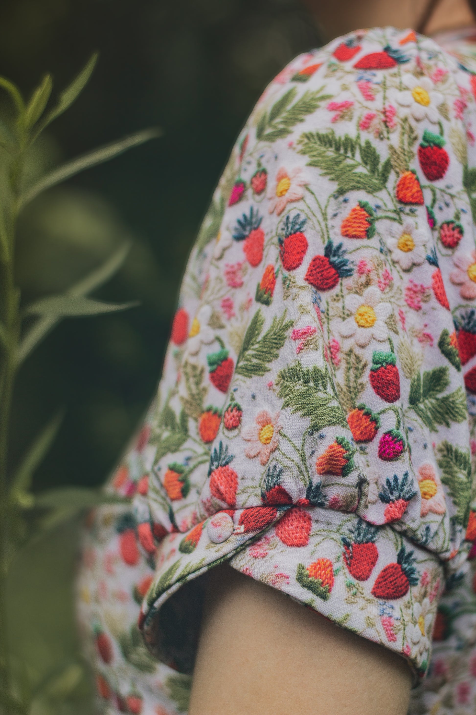 Woman in a floral modest nursing dress.