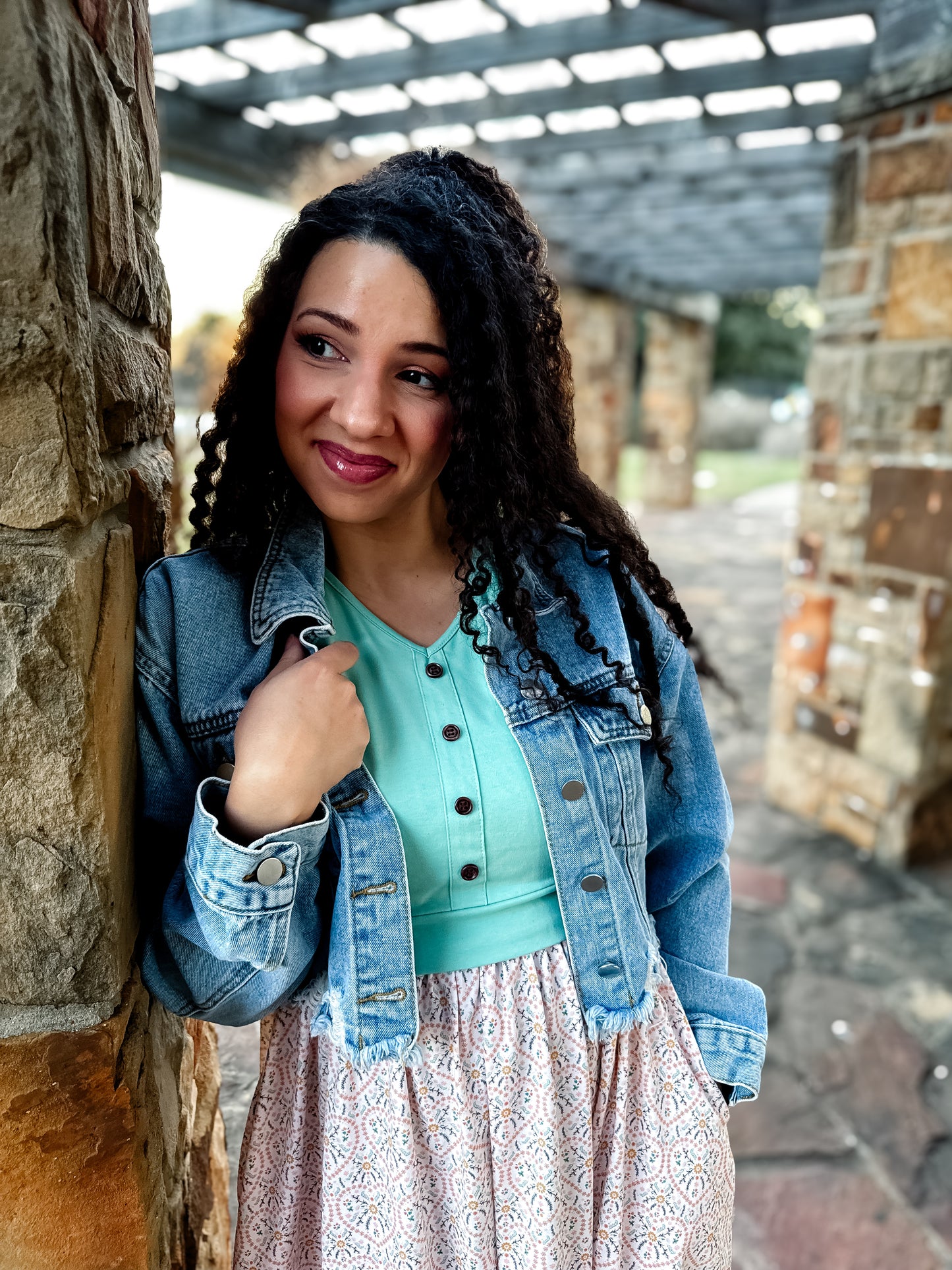 A woman wearing a vintage style modest nursing dress.