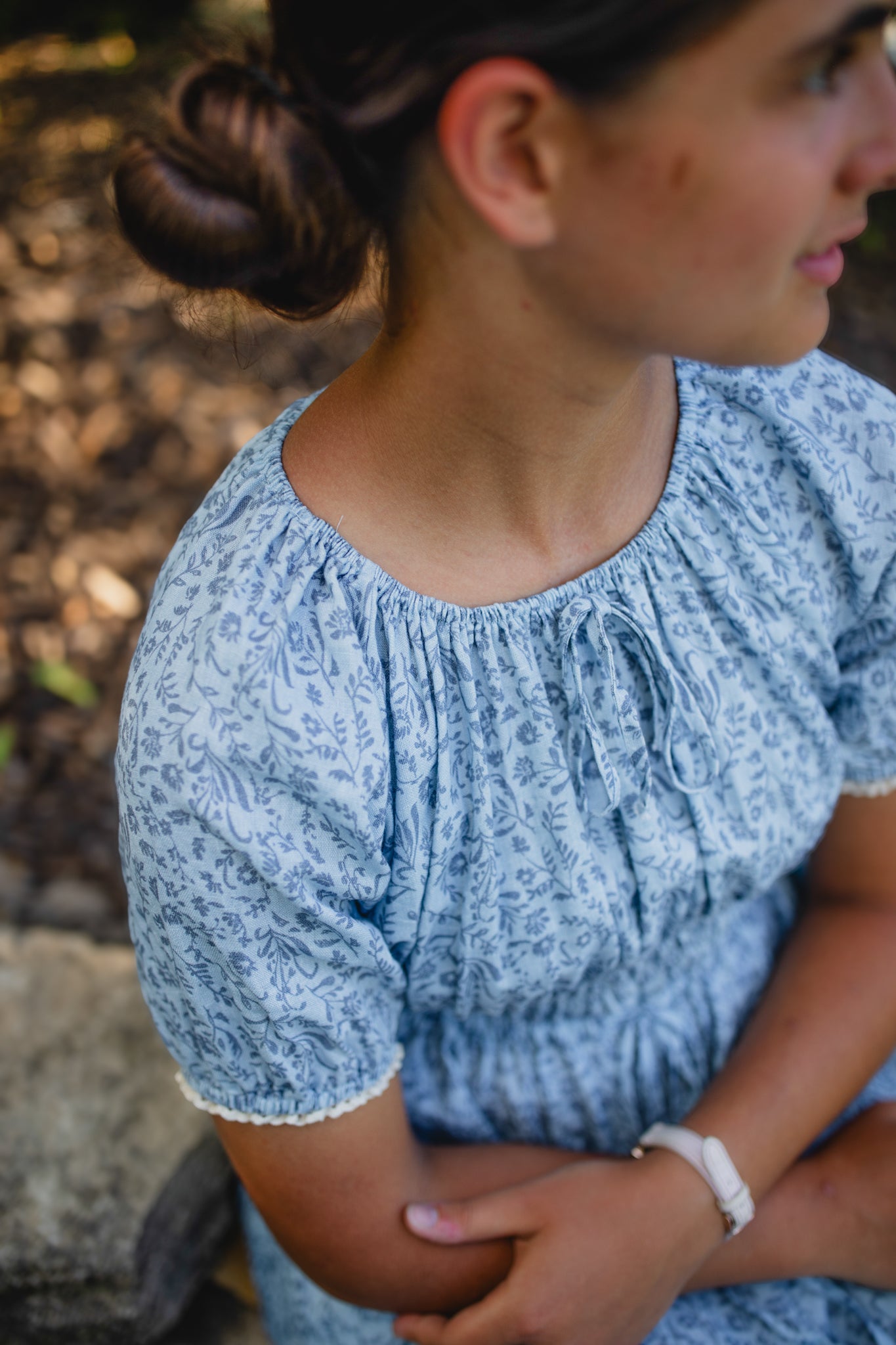 woman in a modest blue nursing dress