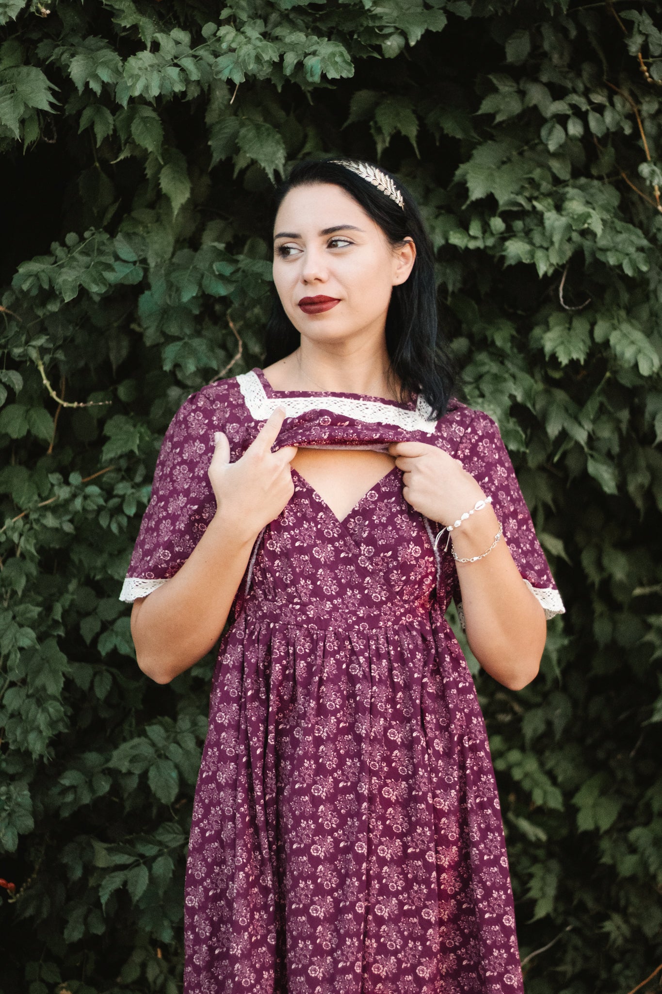 Woman in modest purple floral nursing dress outdoors