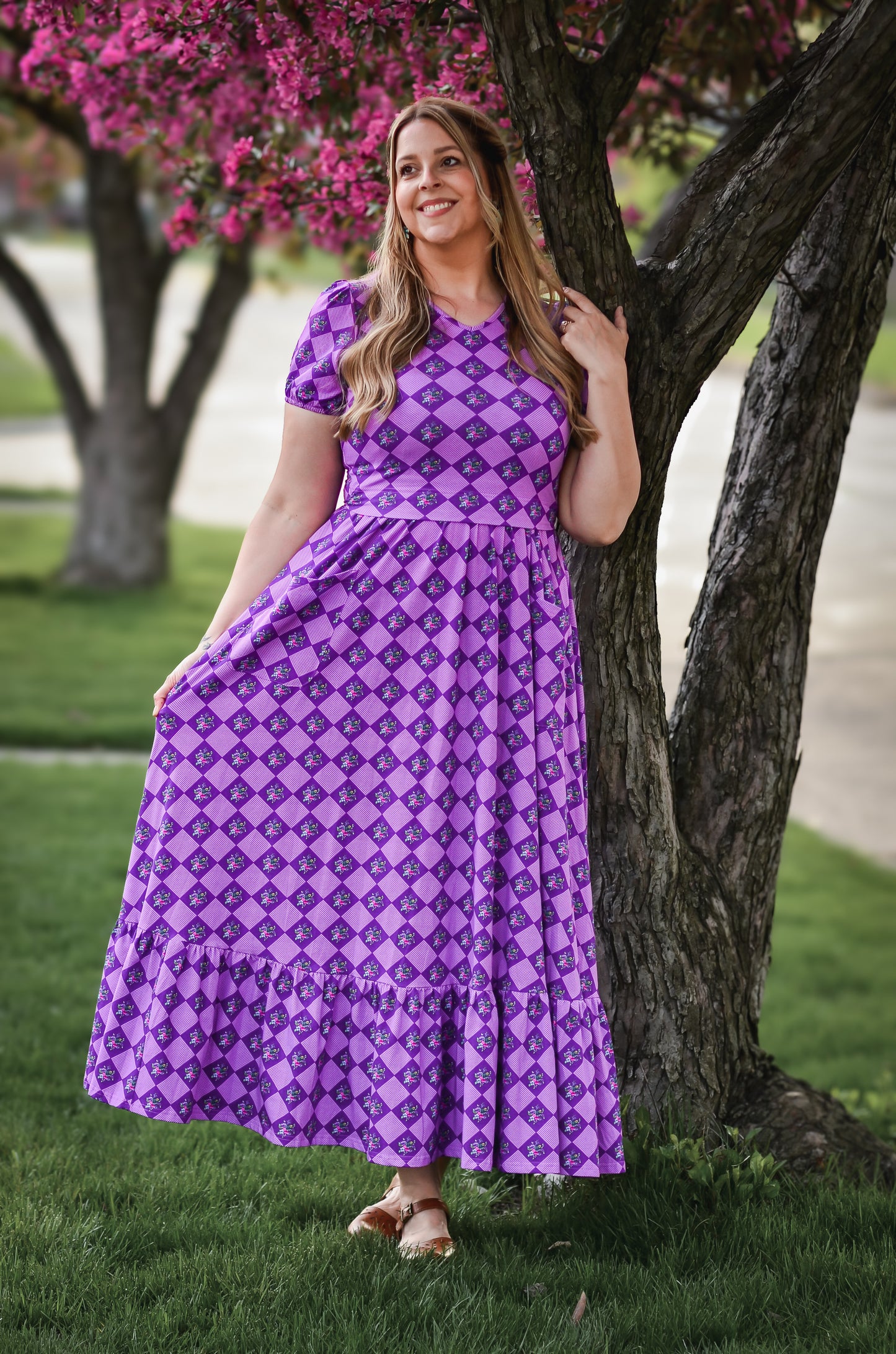 woman wearing patterned purple modest nursing dress