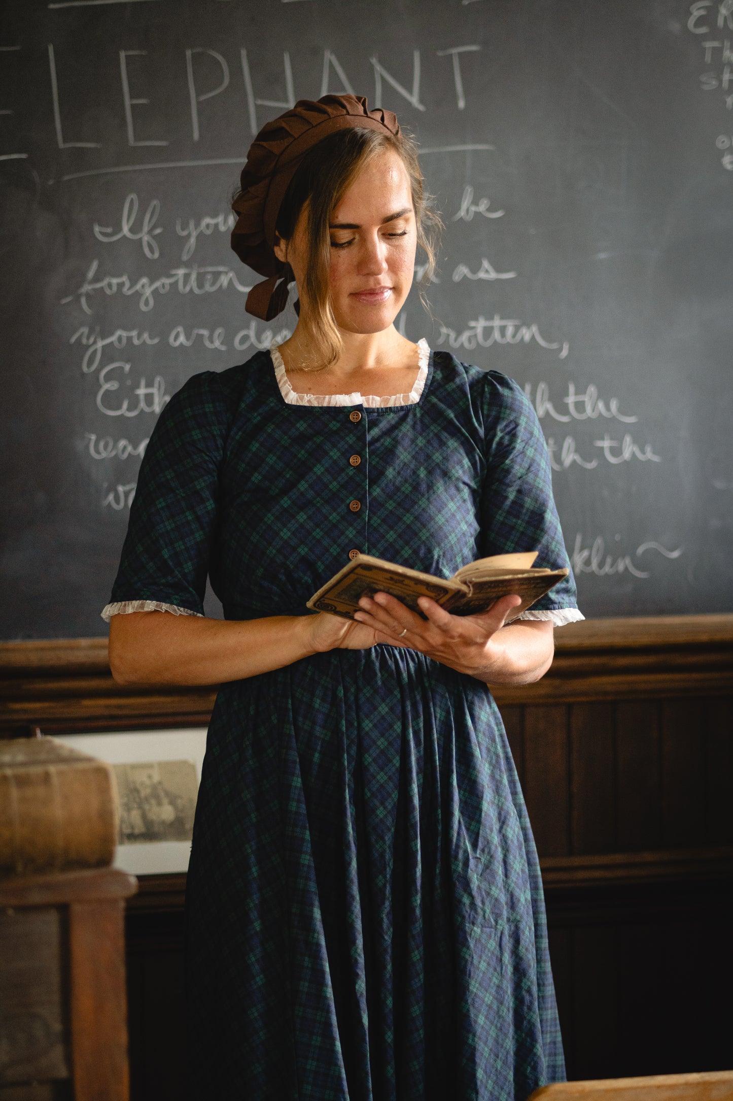 woman wearing a modest nursing blue patterned dress