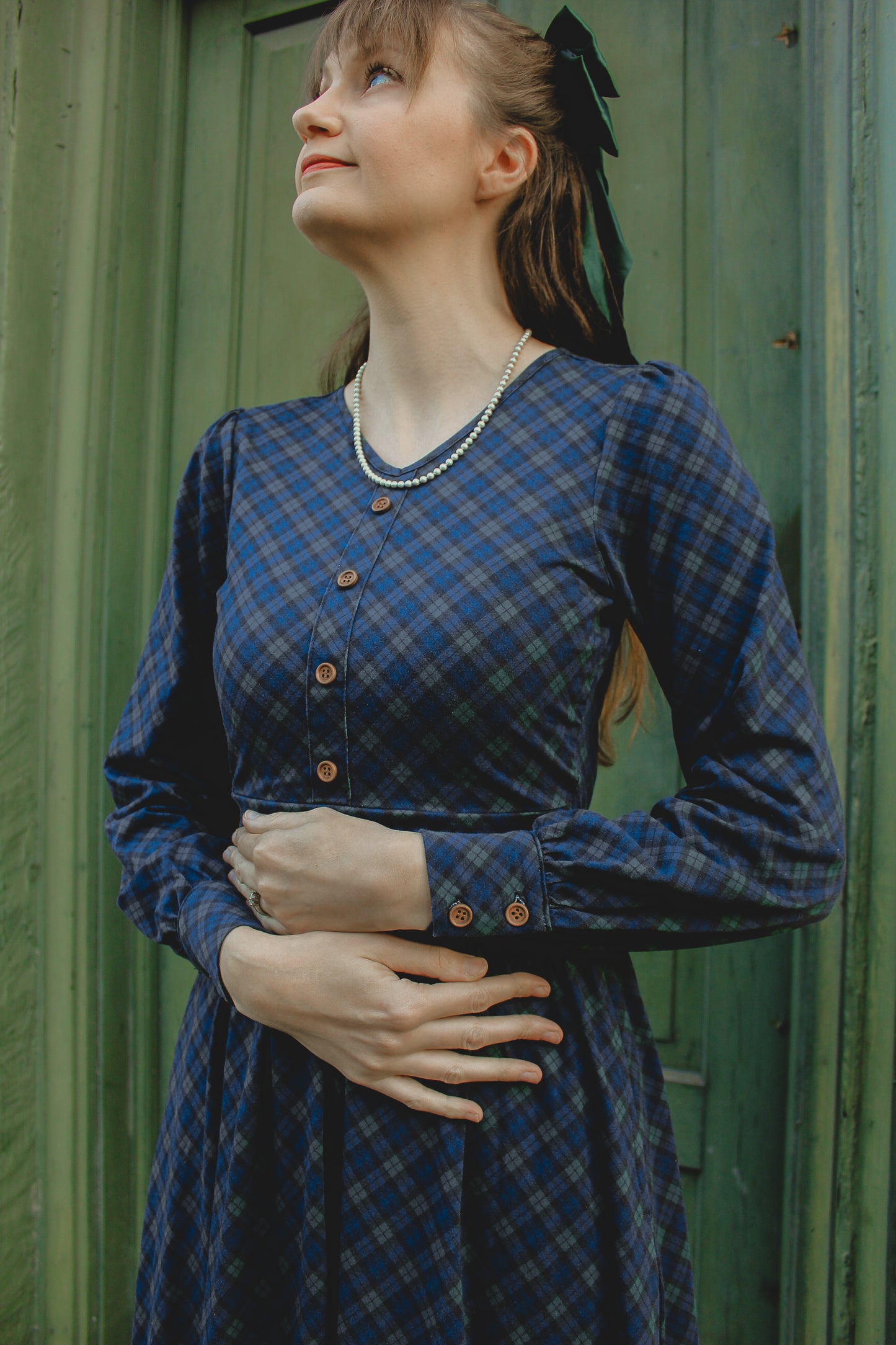 Woman in modest nursing blue plaid dress