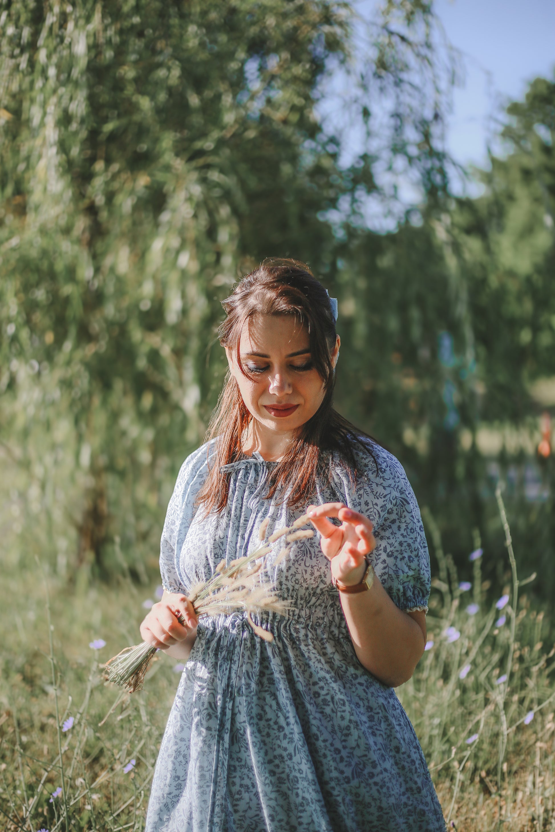 woman in a modest blue nursing dress