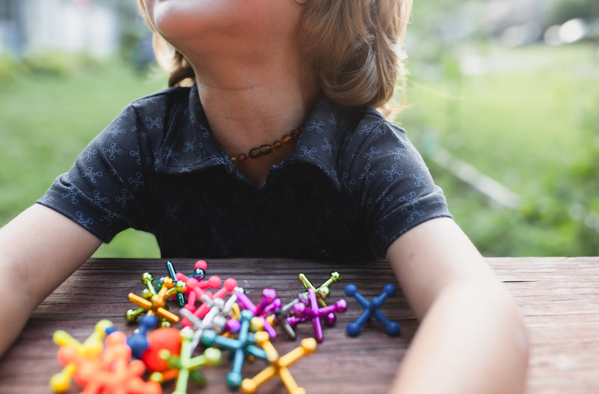 Young boy wearing a dark blue polo shirt