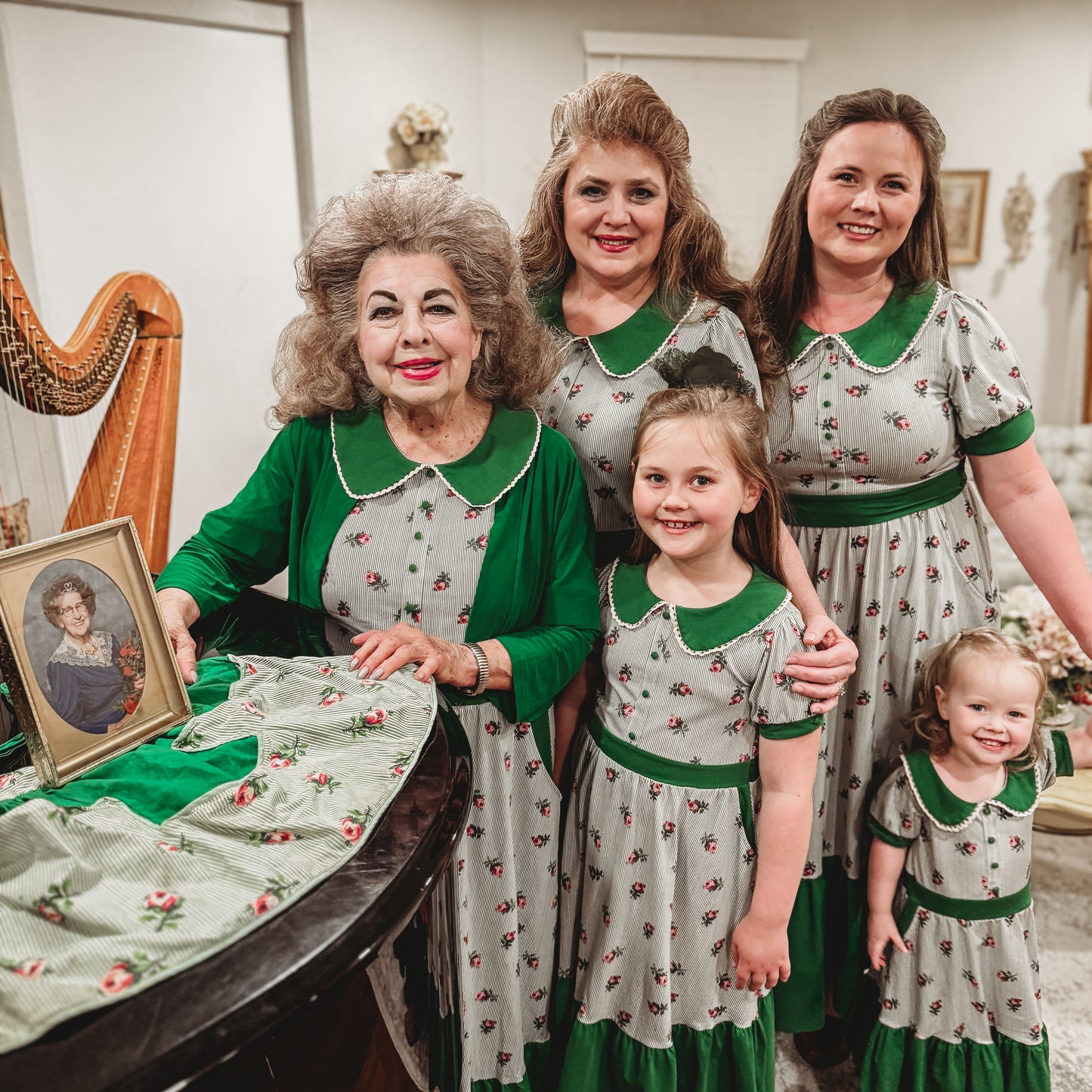 women and young girls wearing green and white striped modest nursing dresses