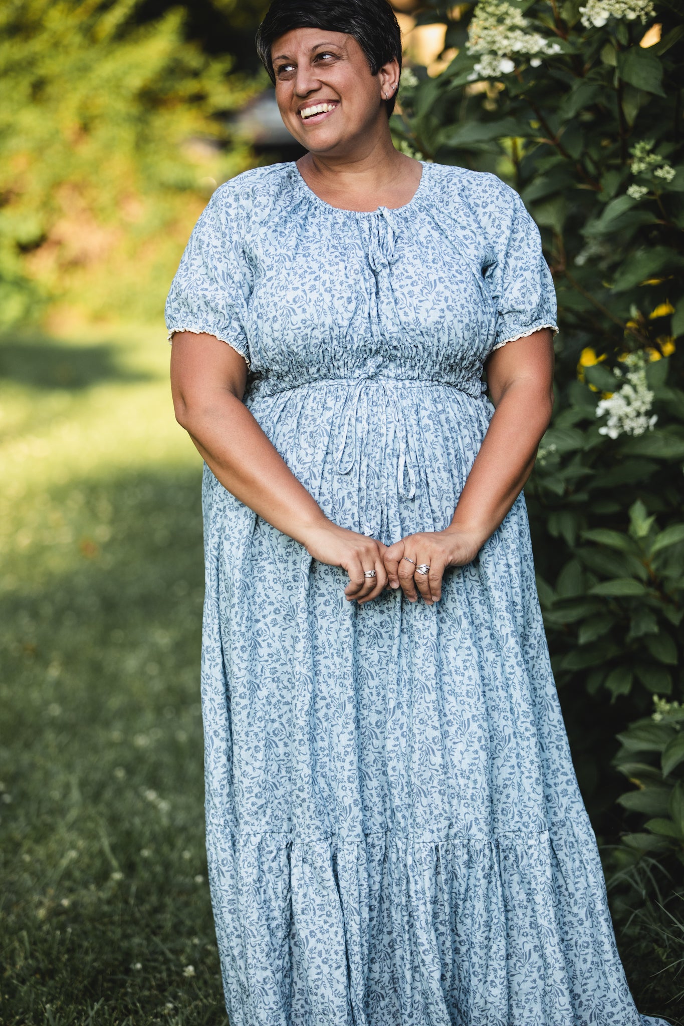 woman in a modest blue nursing dress
