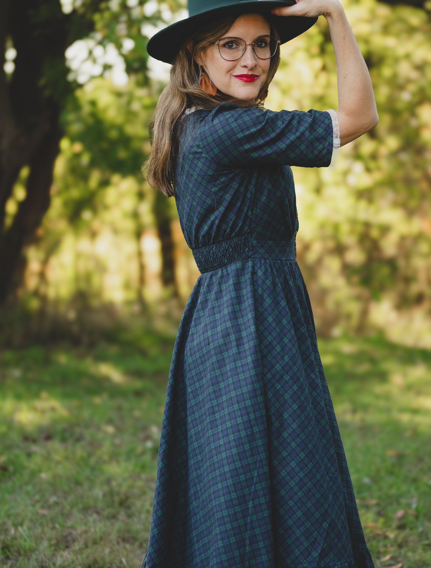 woman wearing a modest nursing blue patterned dress