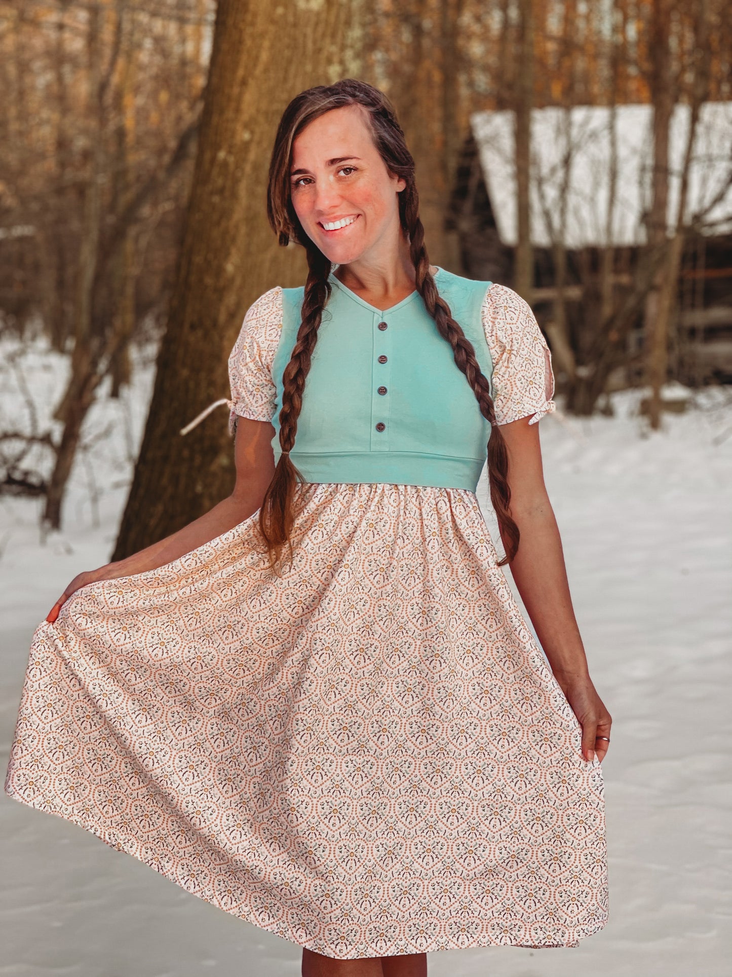 A woman wearing a vintage style modest nursing dress.