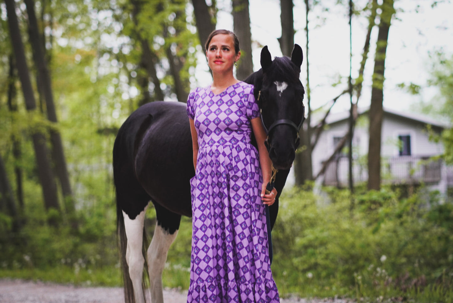 Woman in a purple checkered modest nursing dress