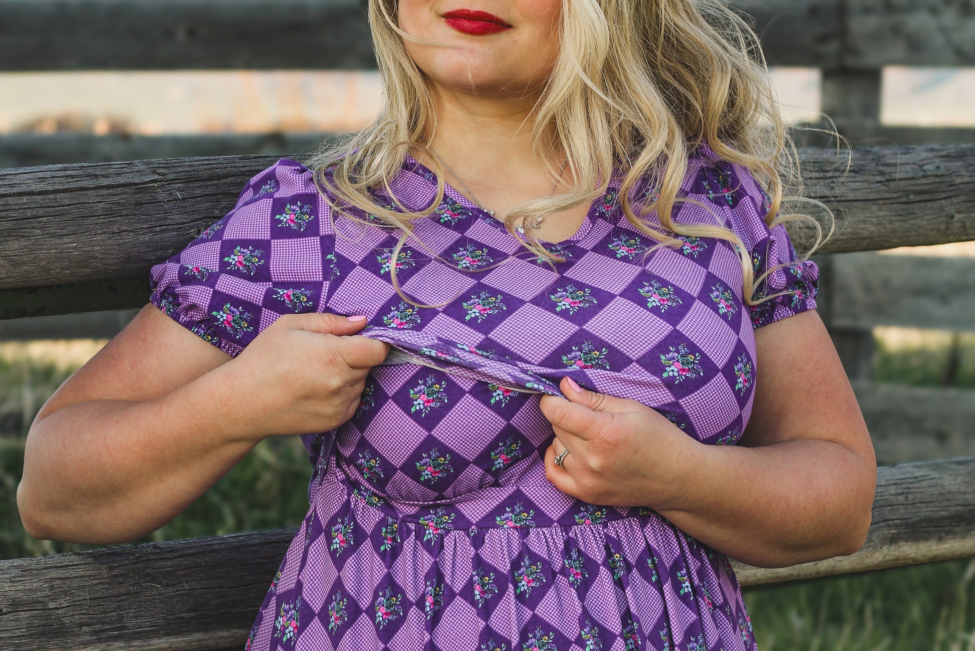 Woman in a purple checkered modest nursing dress.