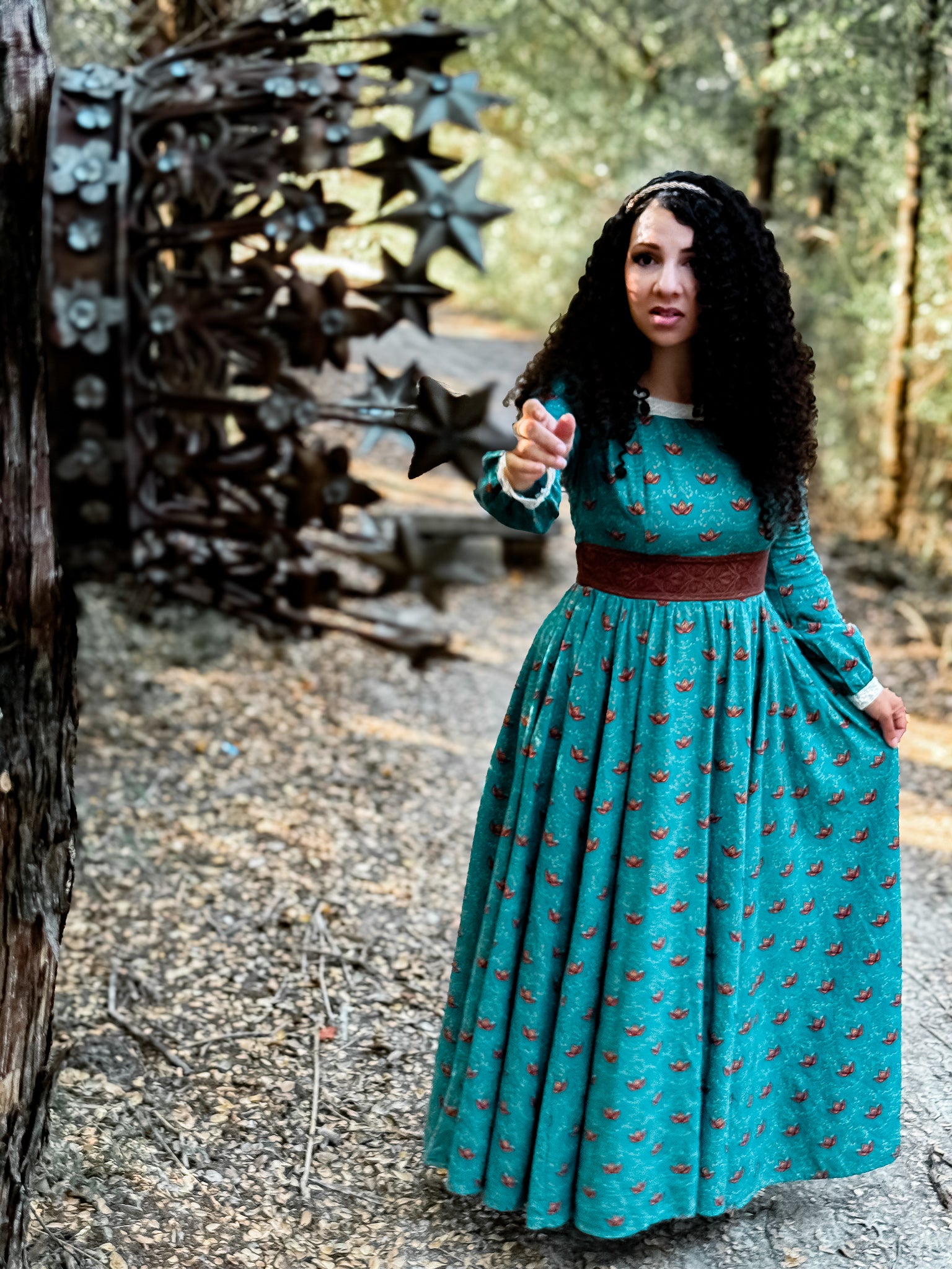 Woman in modest nursing teal dress with crown