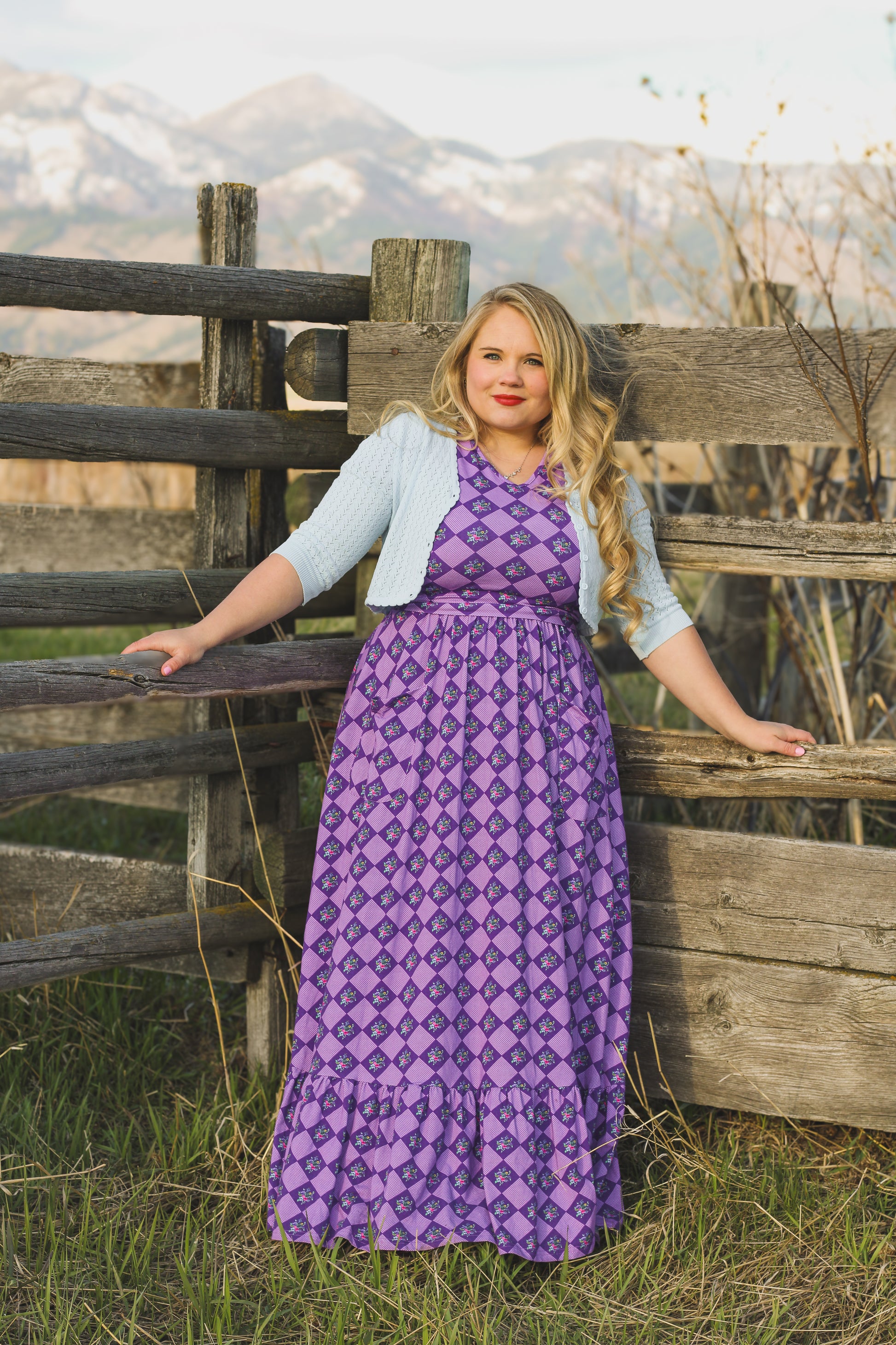 woman wearing patterned purple modest nursing dress