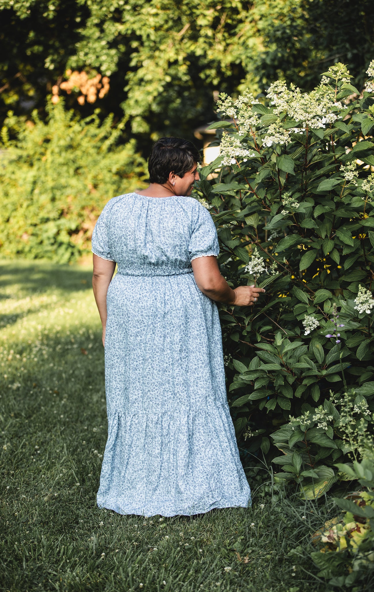 woman in a modest blue nursing dress