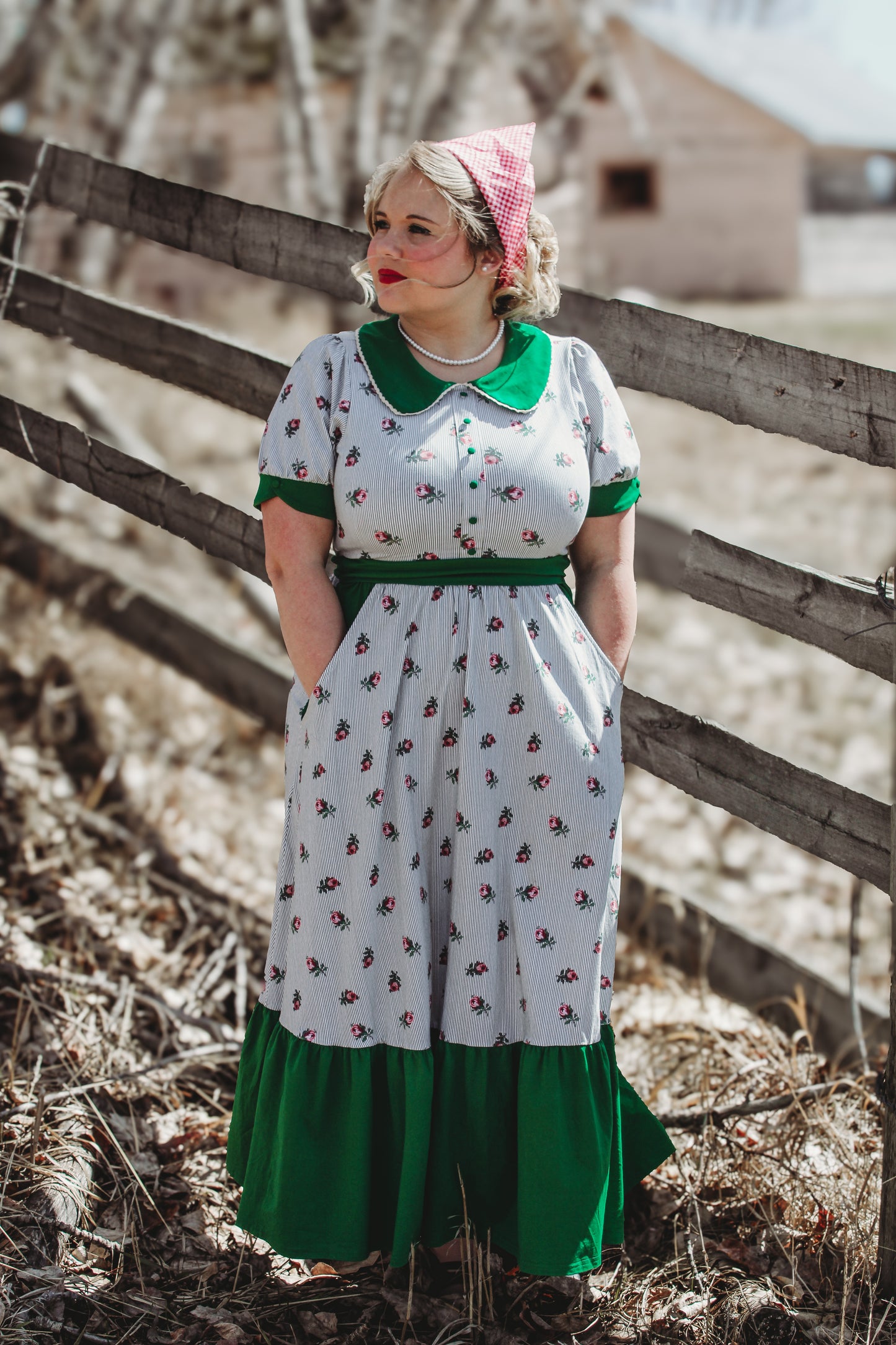 woman wearing a green and white striped modest nursing dress