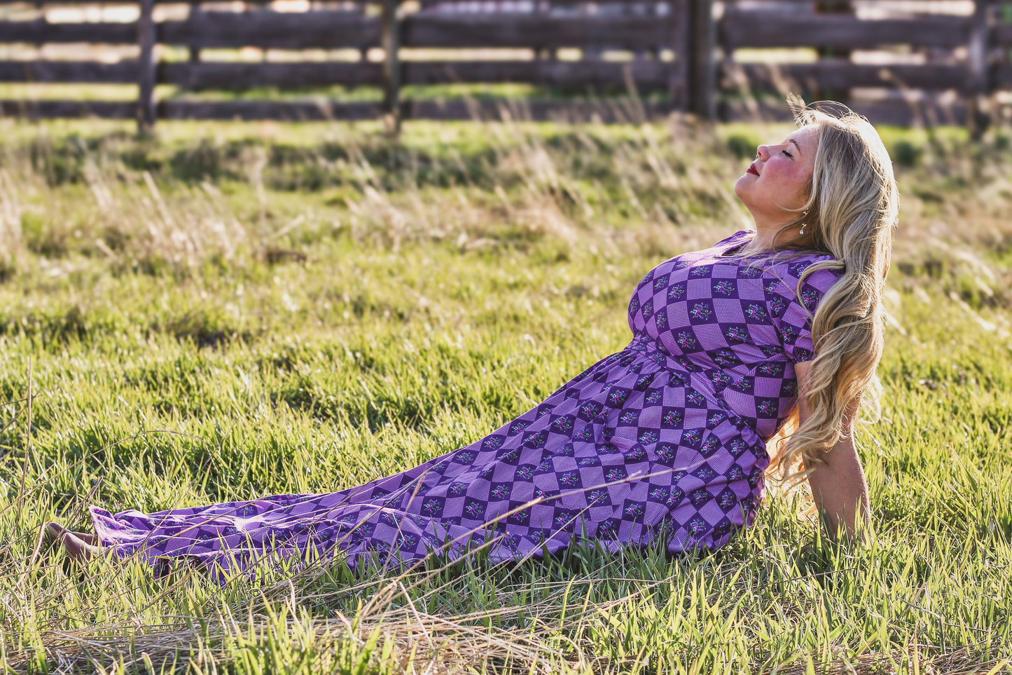woman wearing patterned purple modest nursing dress