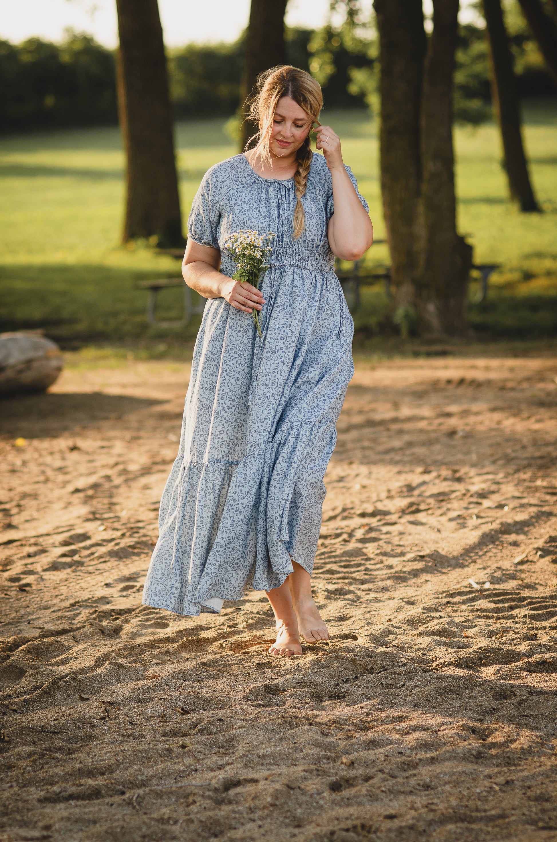woman in a modest blue nursing dress