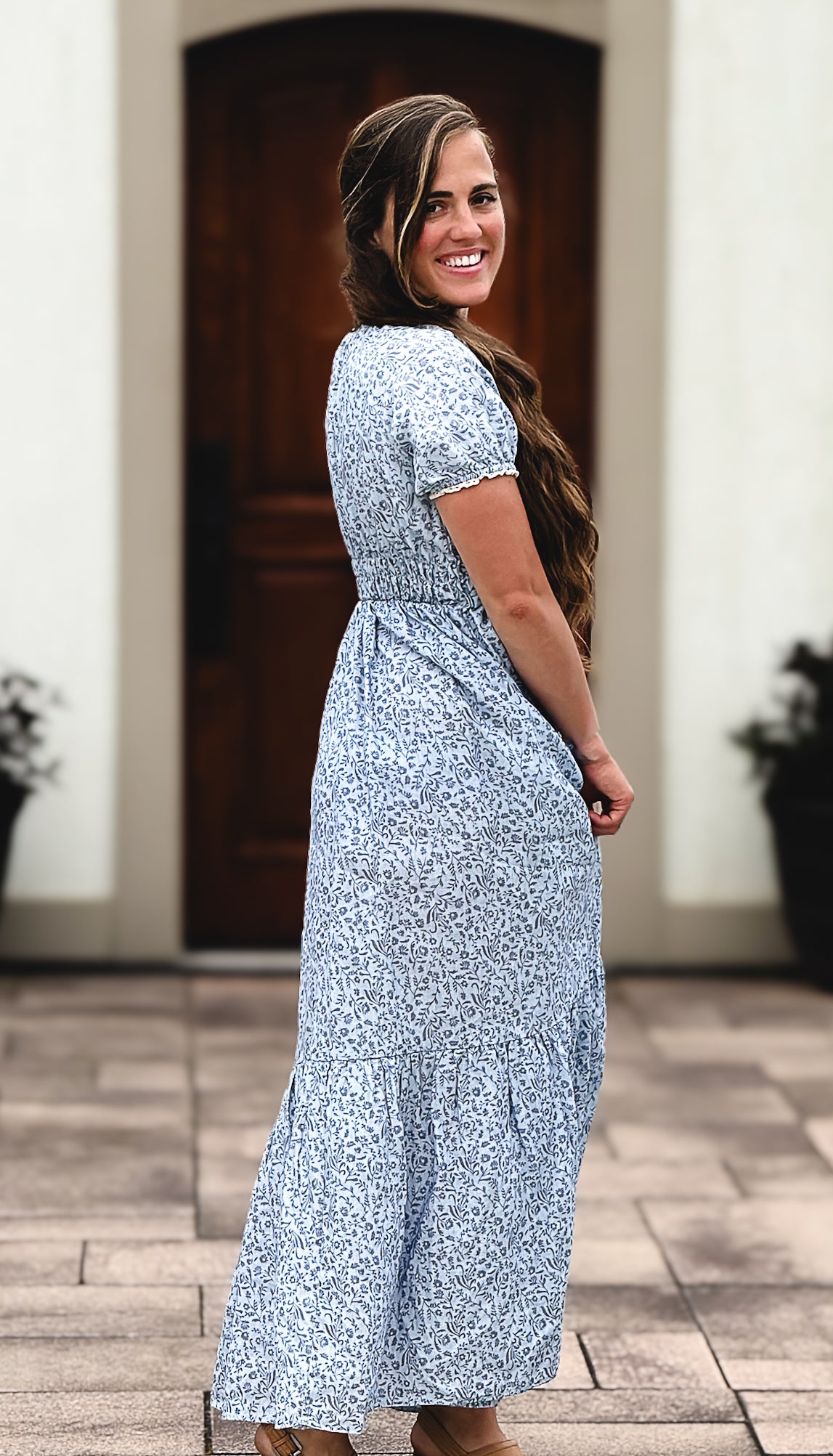 woman in a modest blue nursing dress