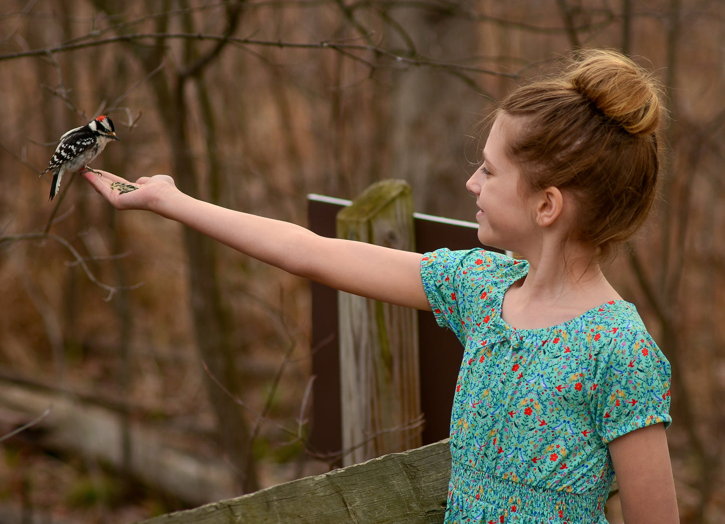 Young girl wearing a modest green dress