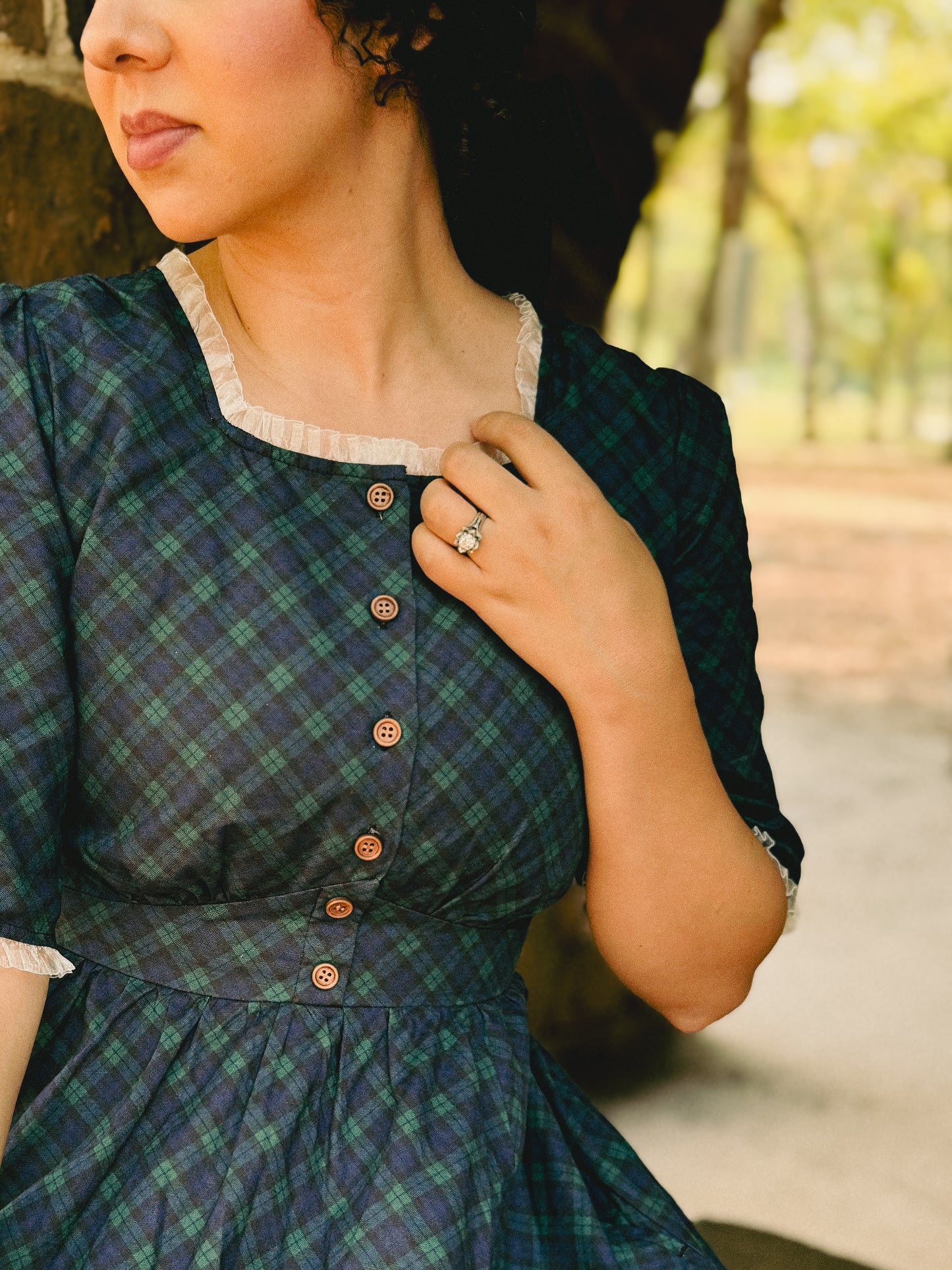 woman wearing a modest nursing blue patterned dress