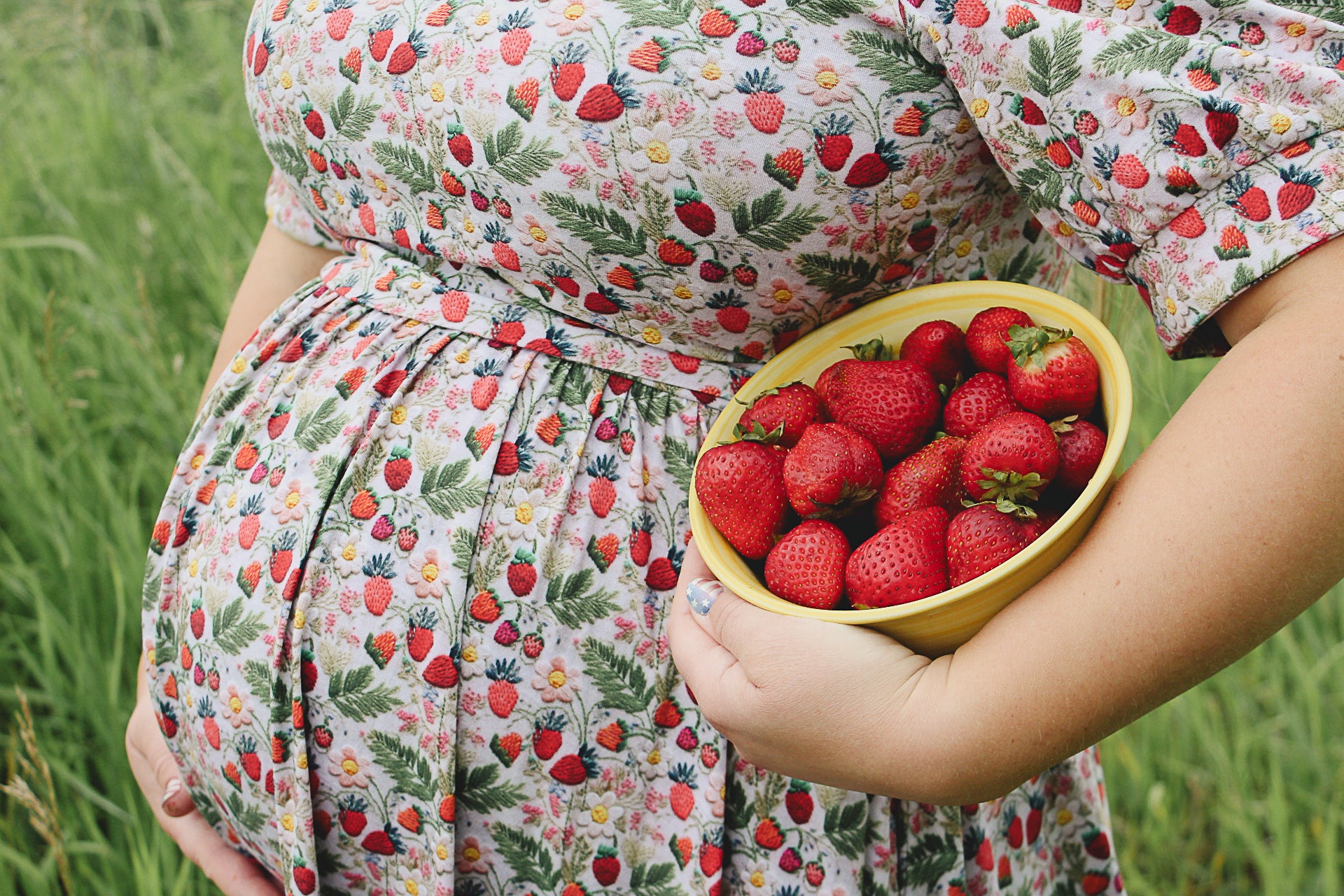 Woman in a floral modest nursing dress.