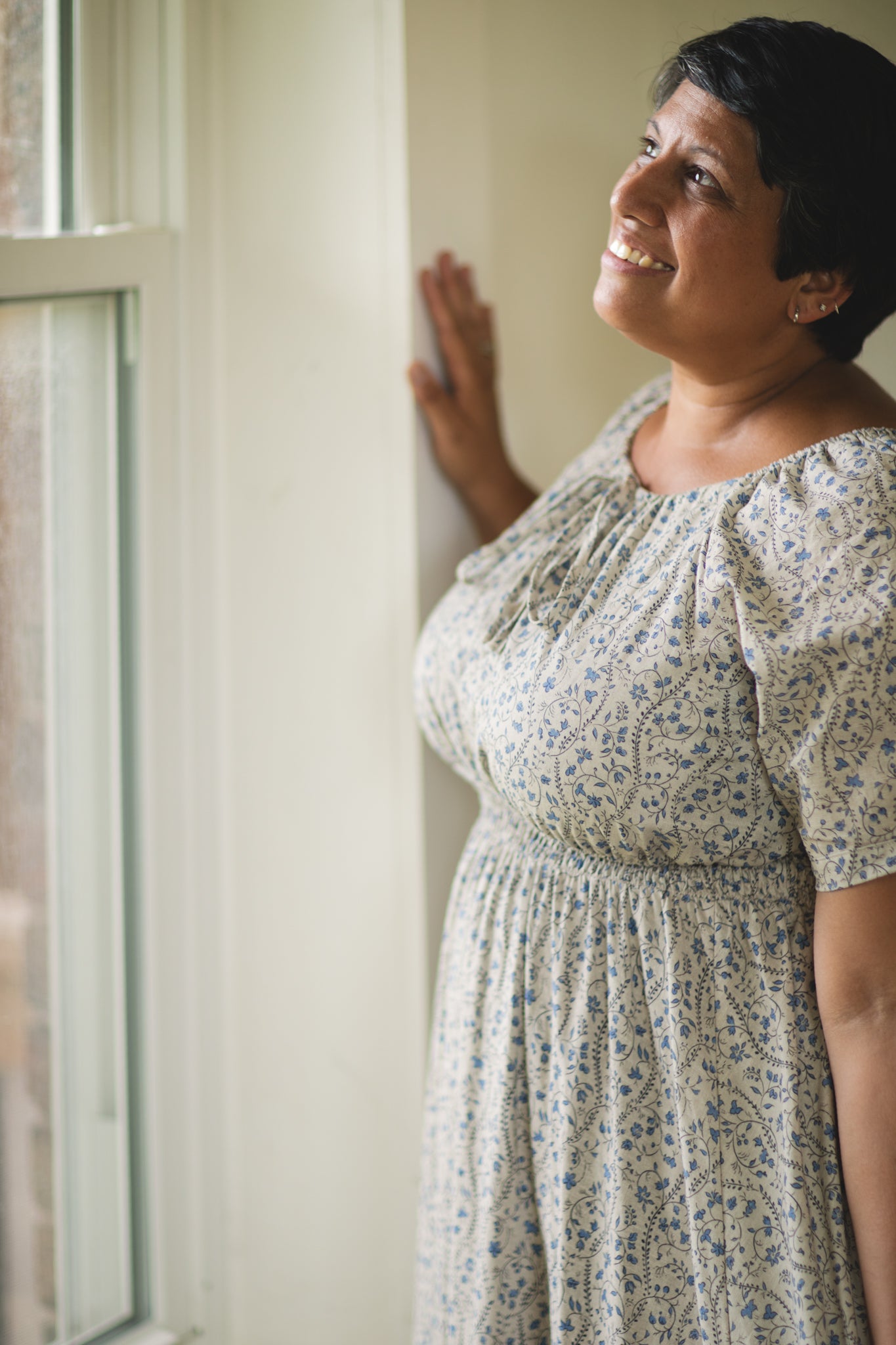 woman in patterned modest nursing dress