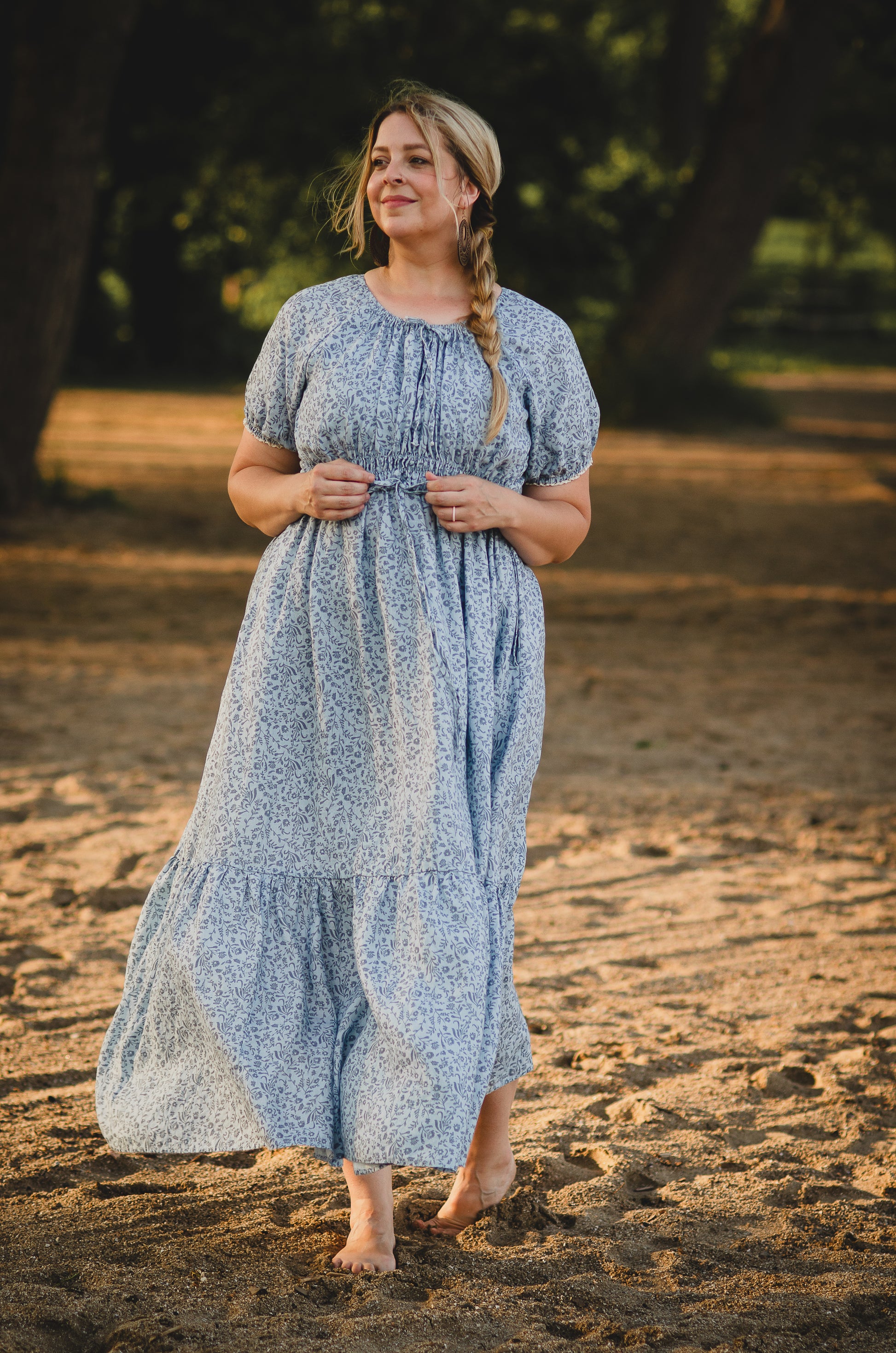 woman in a modest blue nursing dress