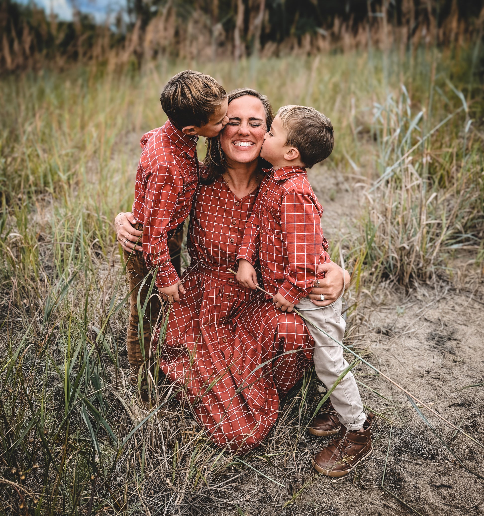 Modest nursing dress mother with two children outdoors
