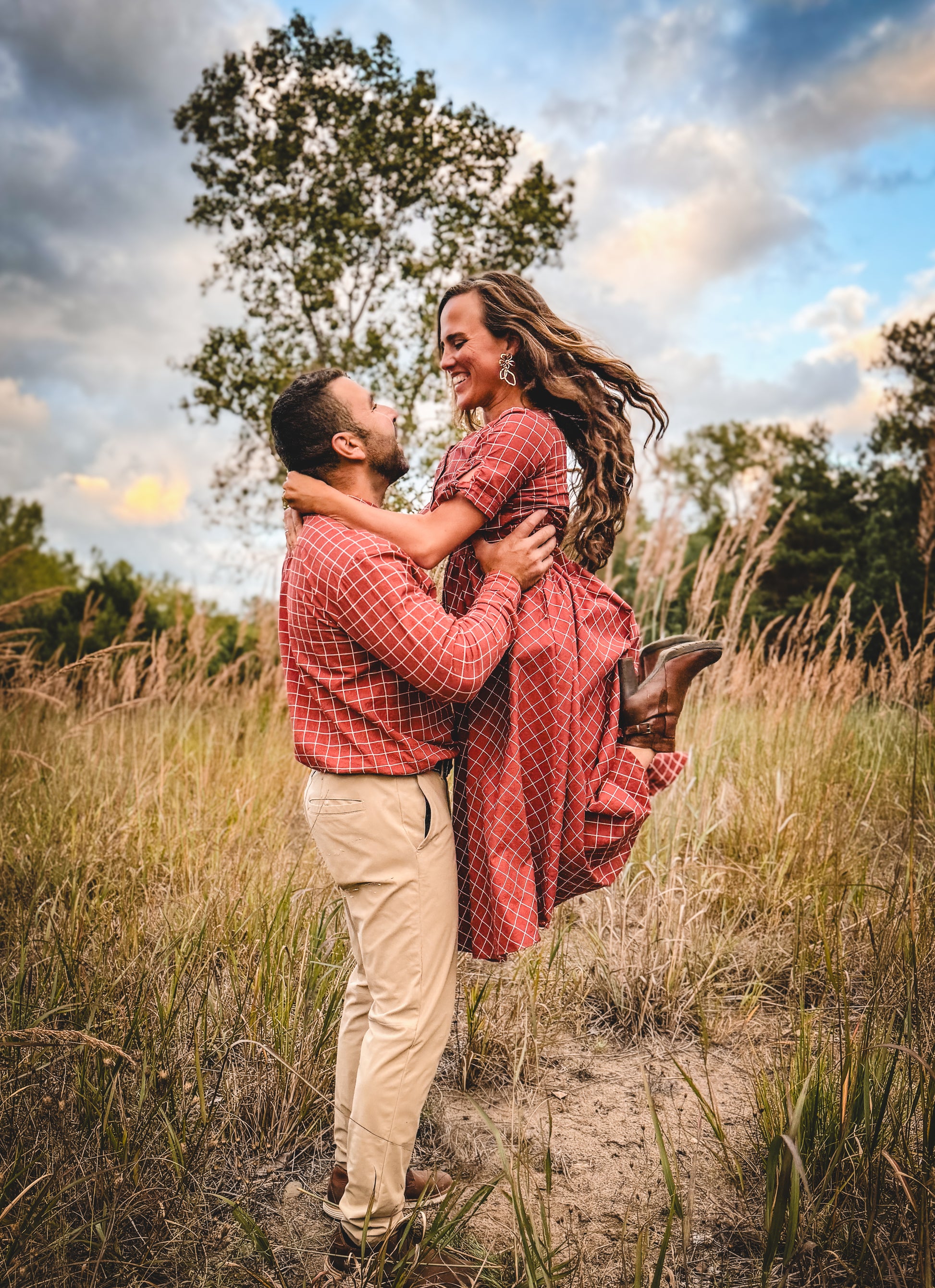 Couple in modest nursing red checkered dress outdoors