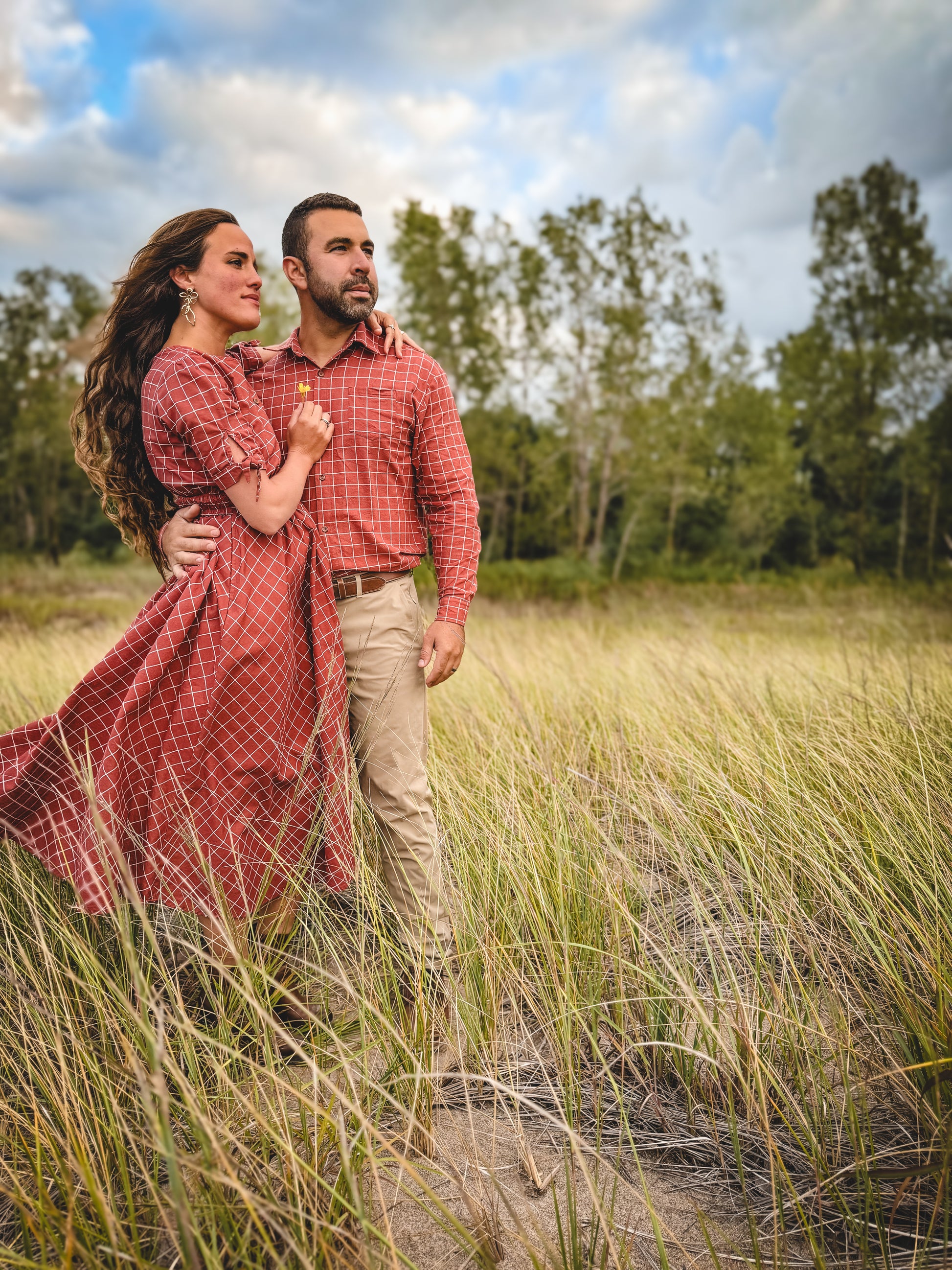 Couple, woman in modest nursing checkered dress outdoors