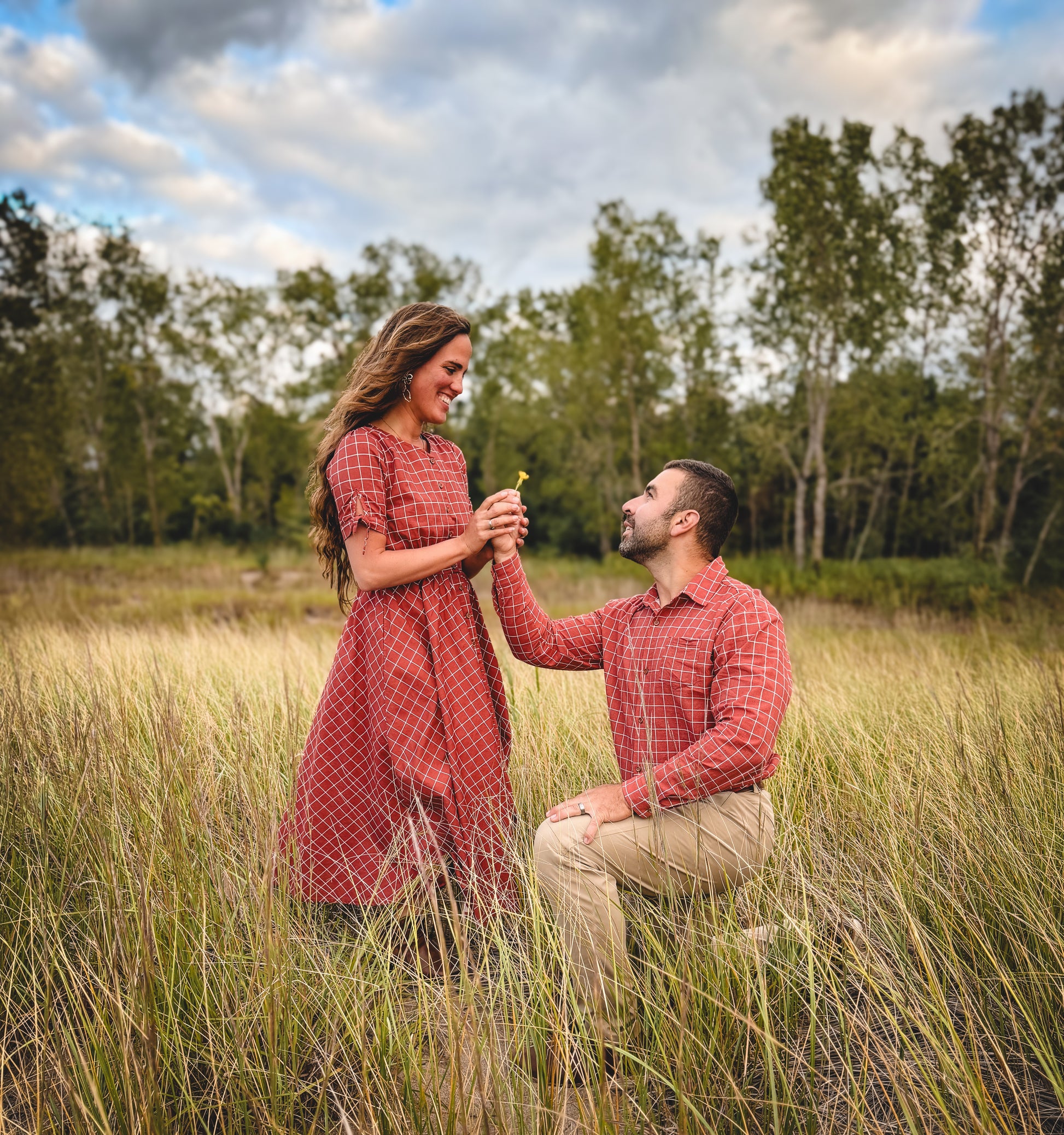 Couple, woman in modest nursing dress, proposal outdoors