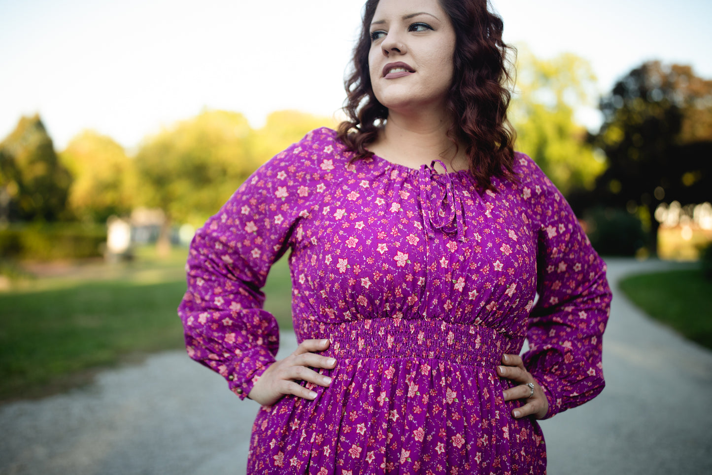 Woman in modest purple nursing dress outdoors