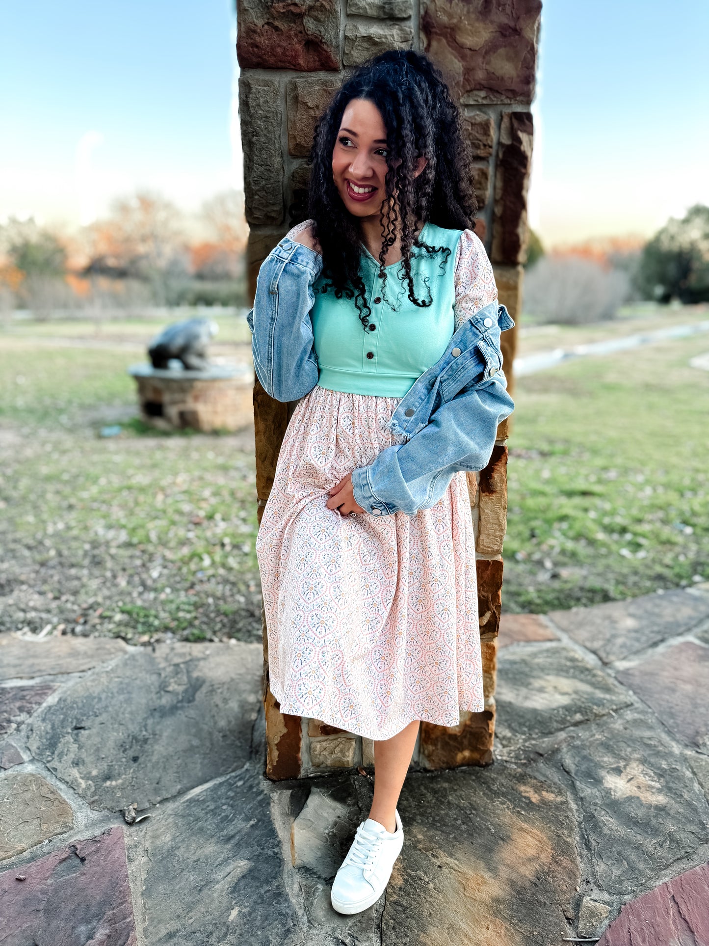 A woman wearing a vintage style modest nursing dress.