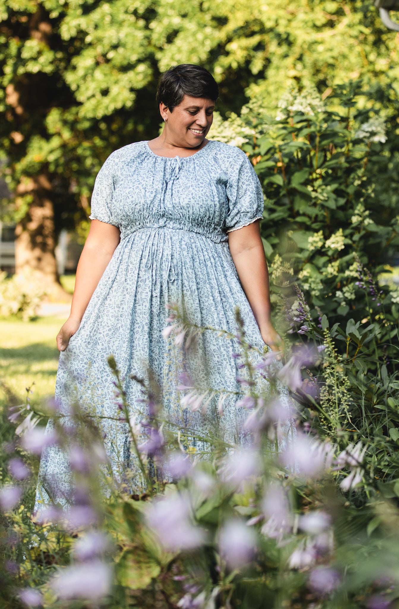 woman in a modest blue nursing dress