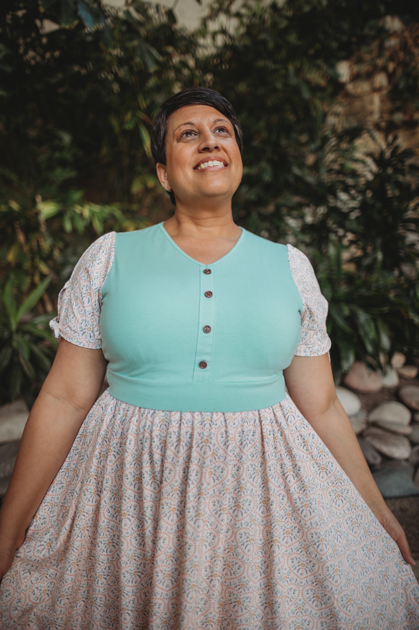 A woman wearing a vintage style modest nursing dress.