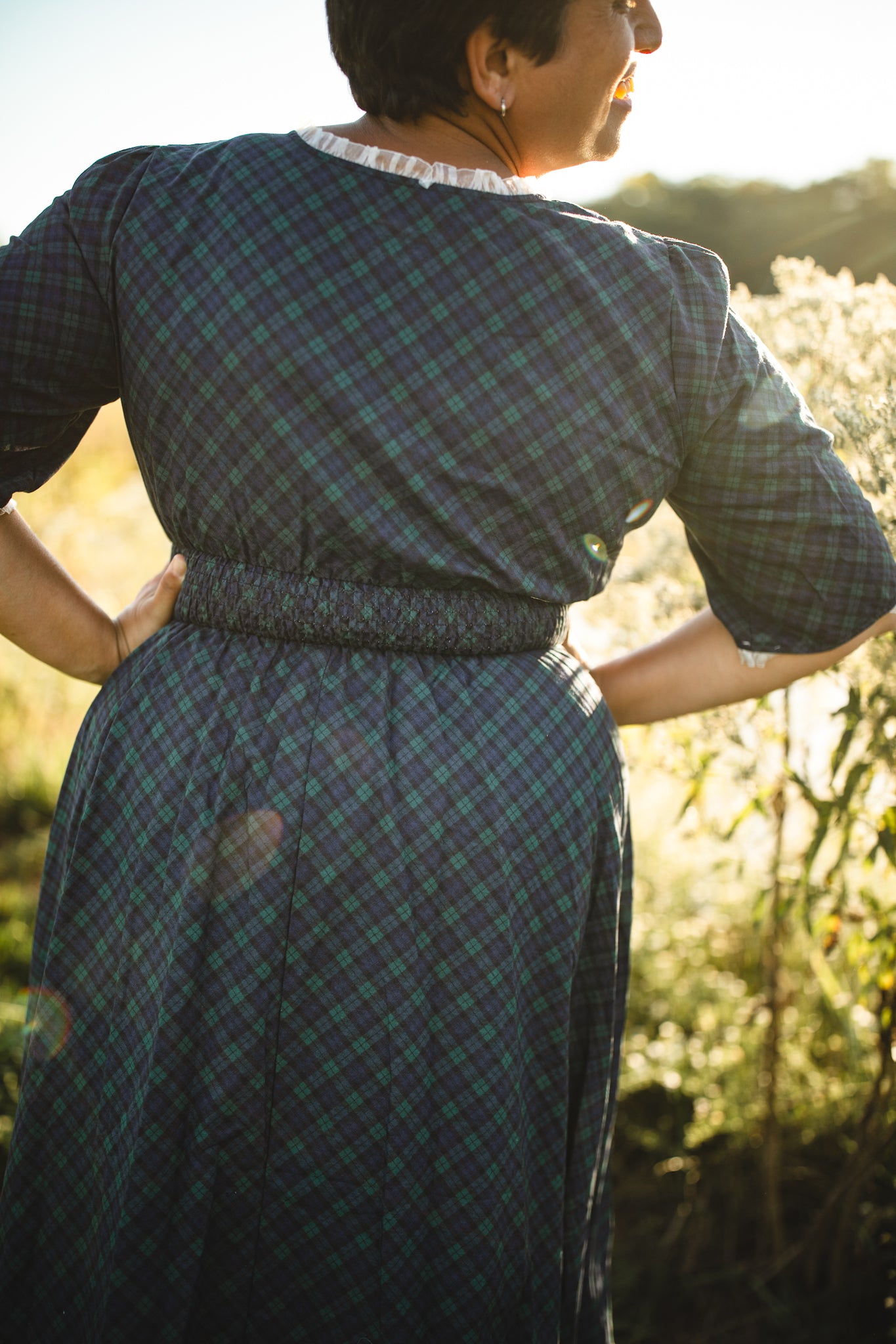 woman wearing a modest nursing blue patterned dress
