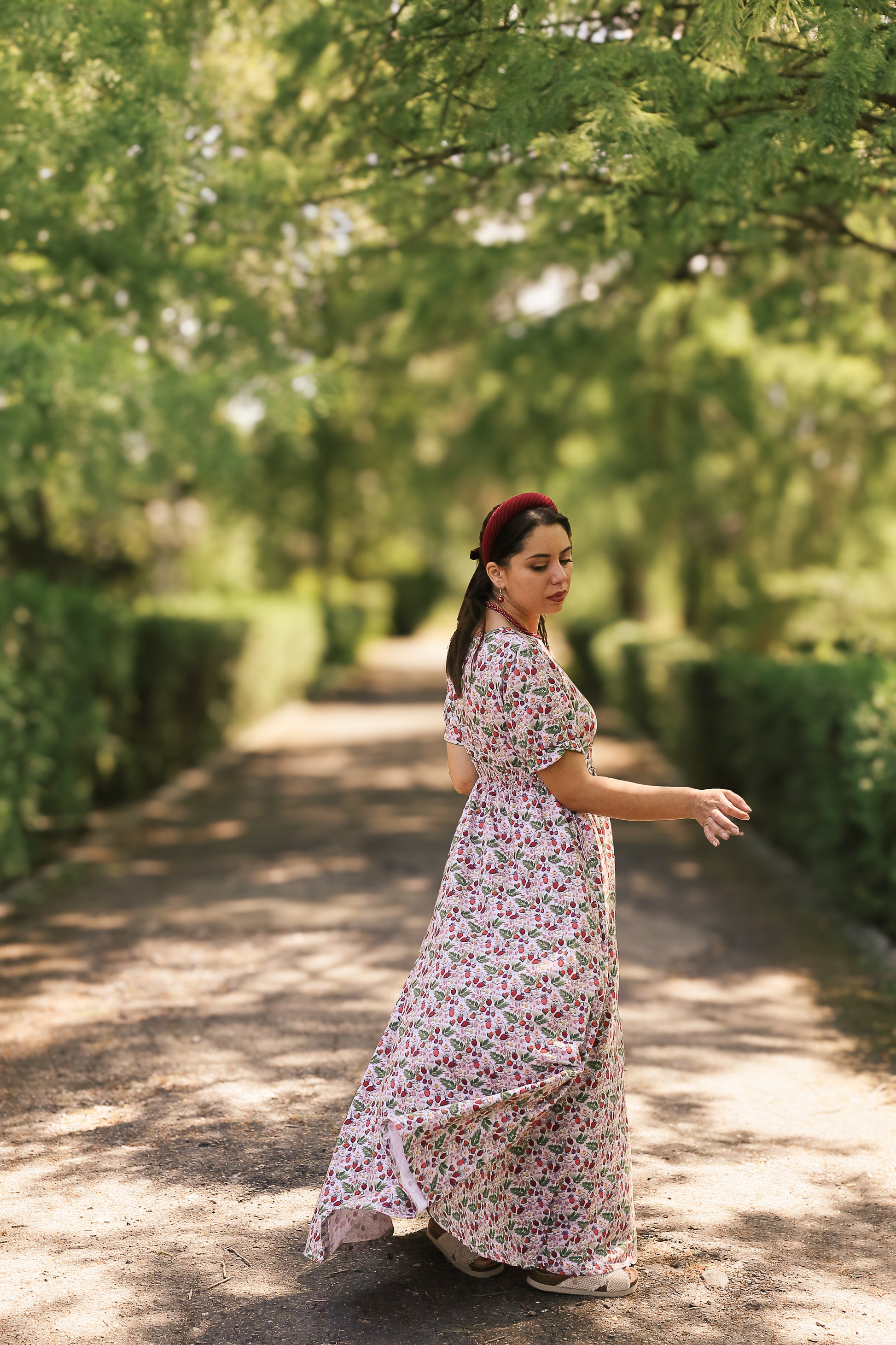 Woman in a floral modest nursing dress