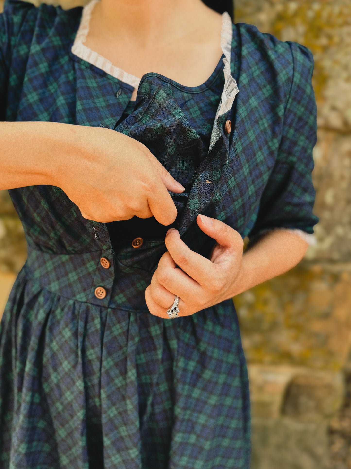 woman wearing a modest nursing blue patterned dress