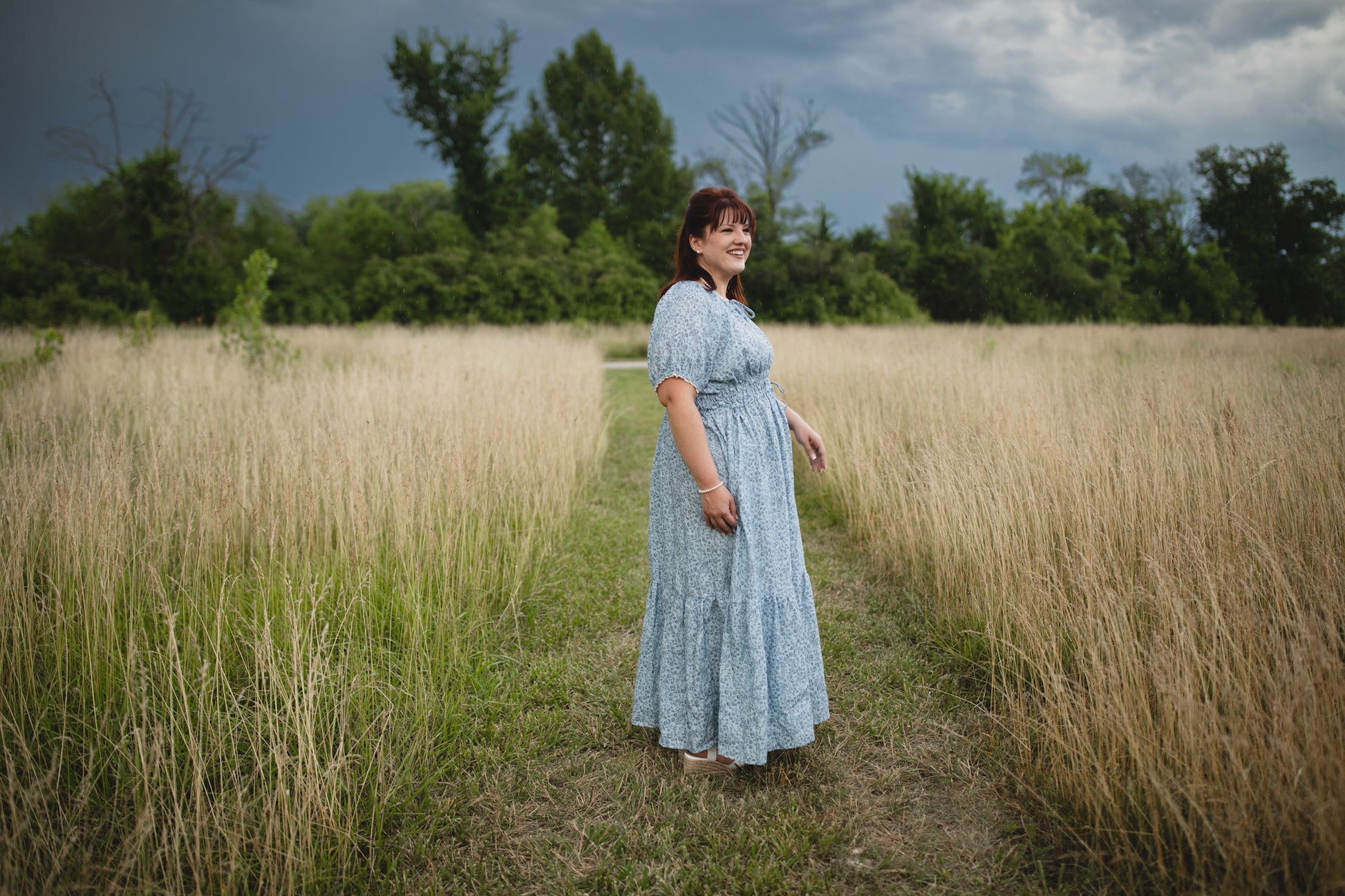 woman in a modest blue nursing dress