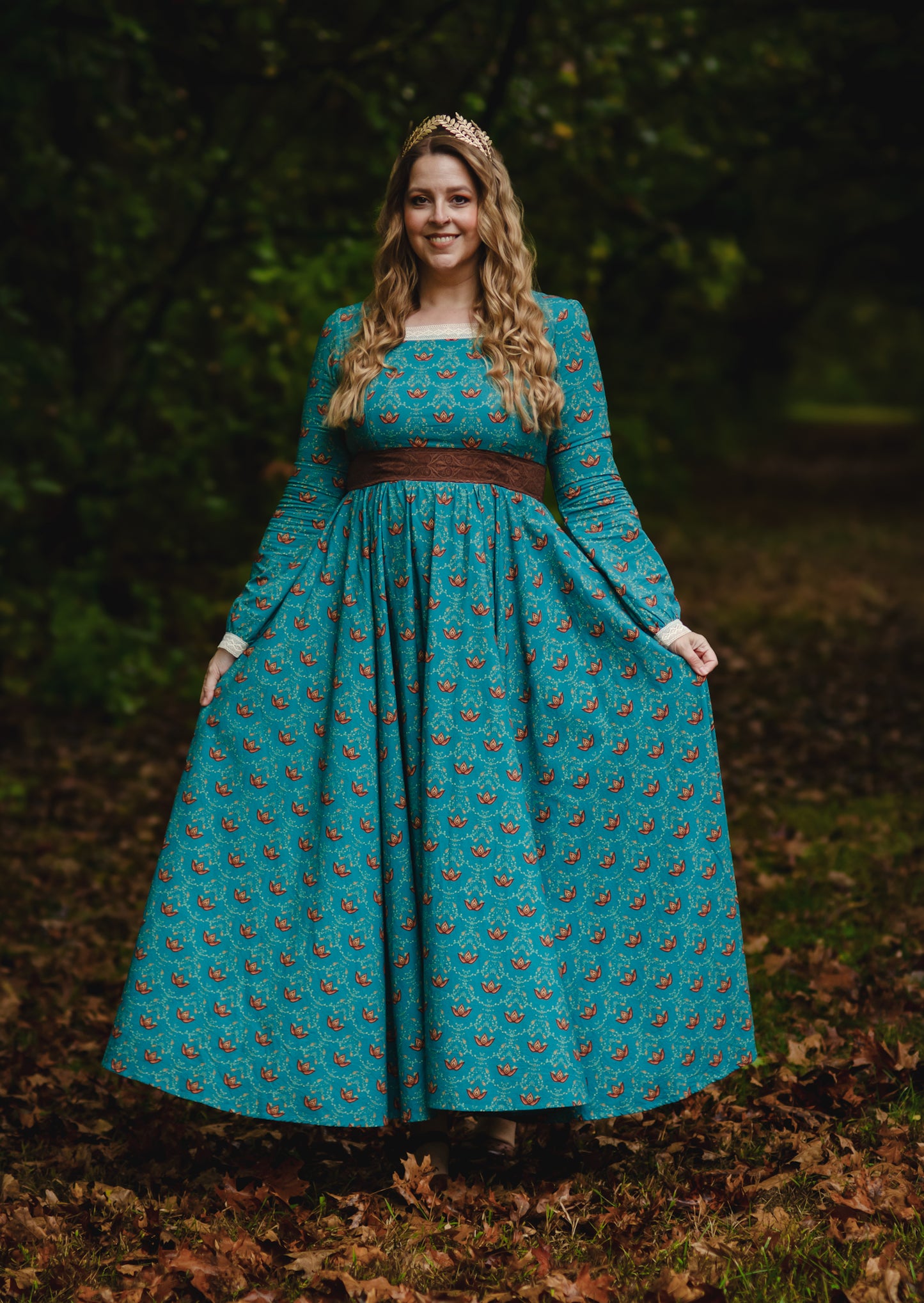 Woman in modest nursing teal patterned dress outside