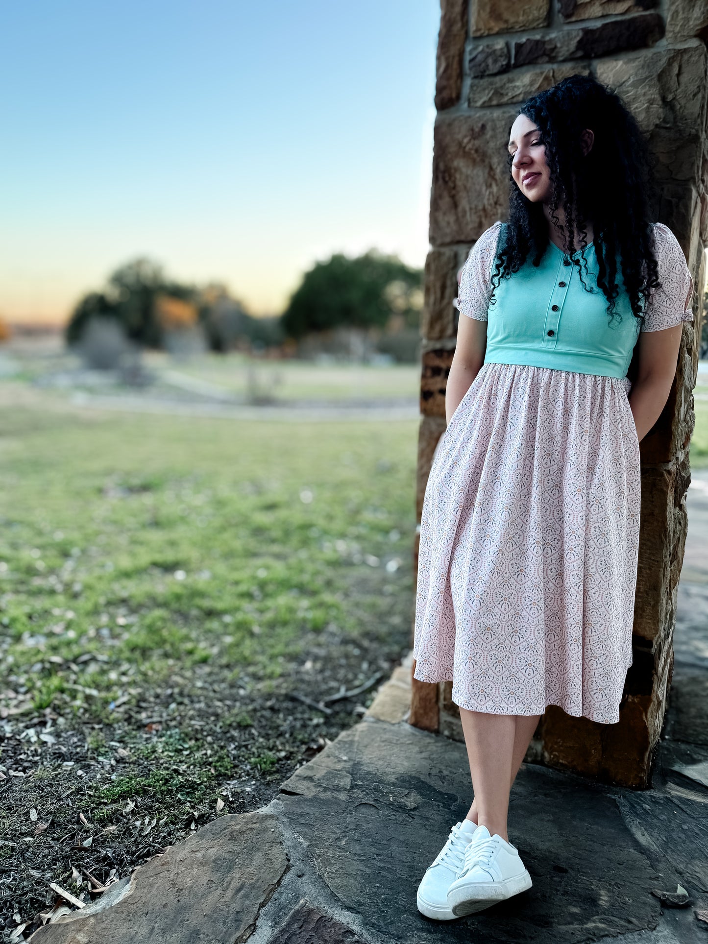A woman wearing a vintage style modest nursing dress.