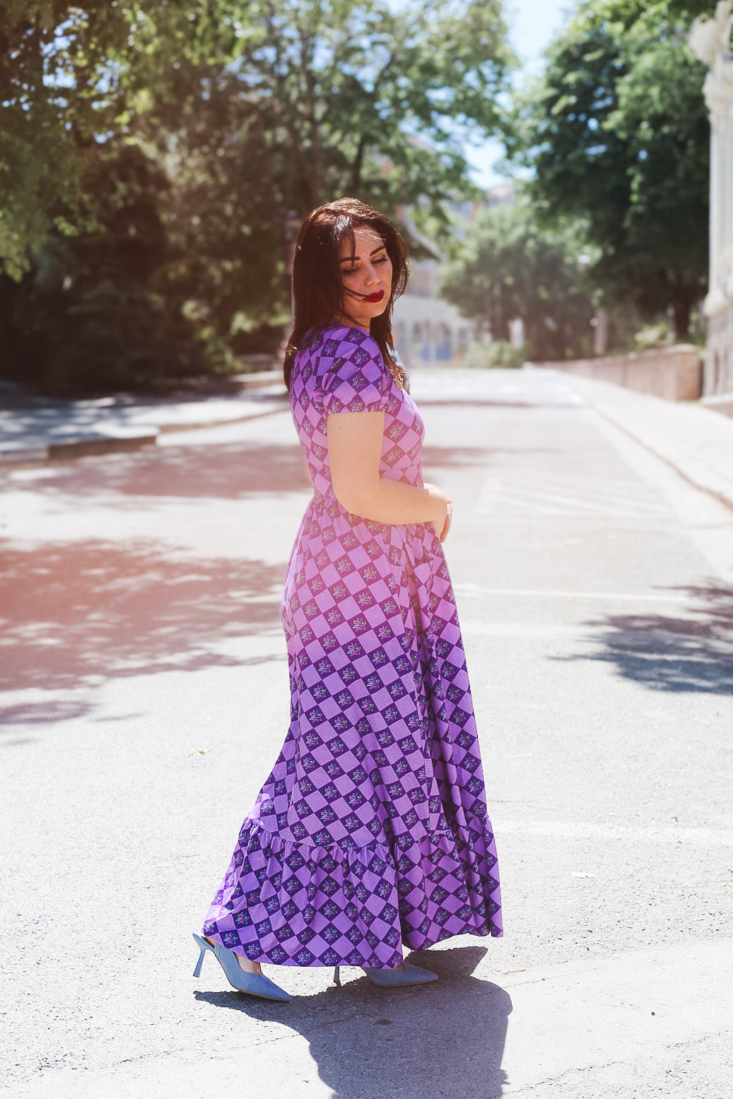 woman wearing patterned purple modest nursing dress
