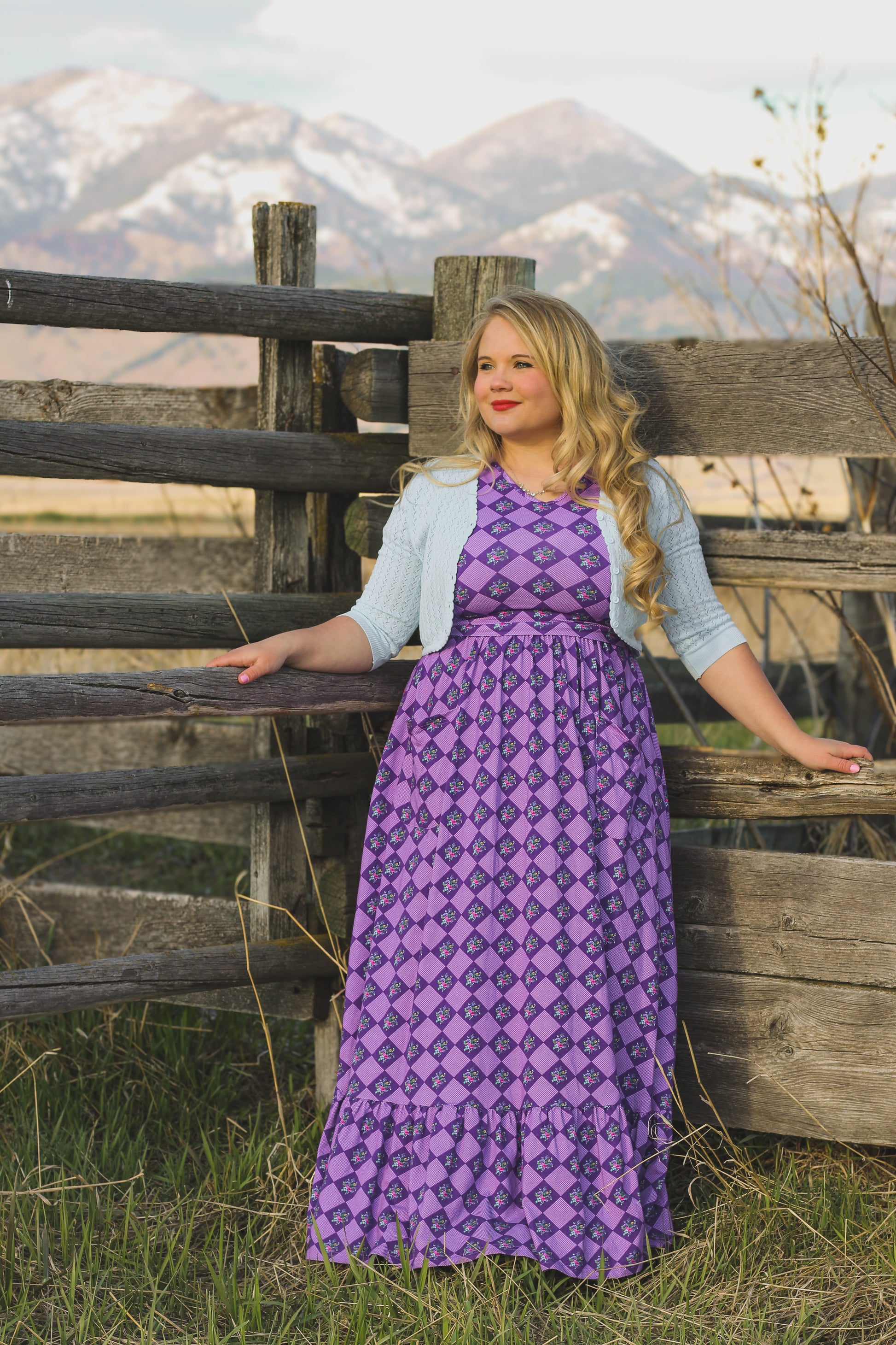 woman wearing patterned purple modest nursing dress