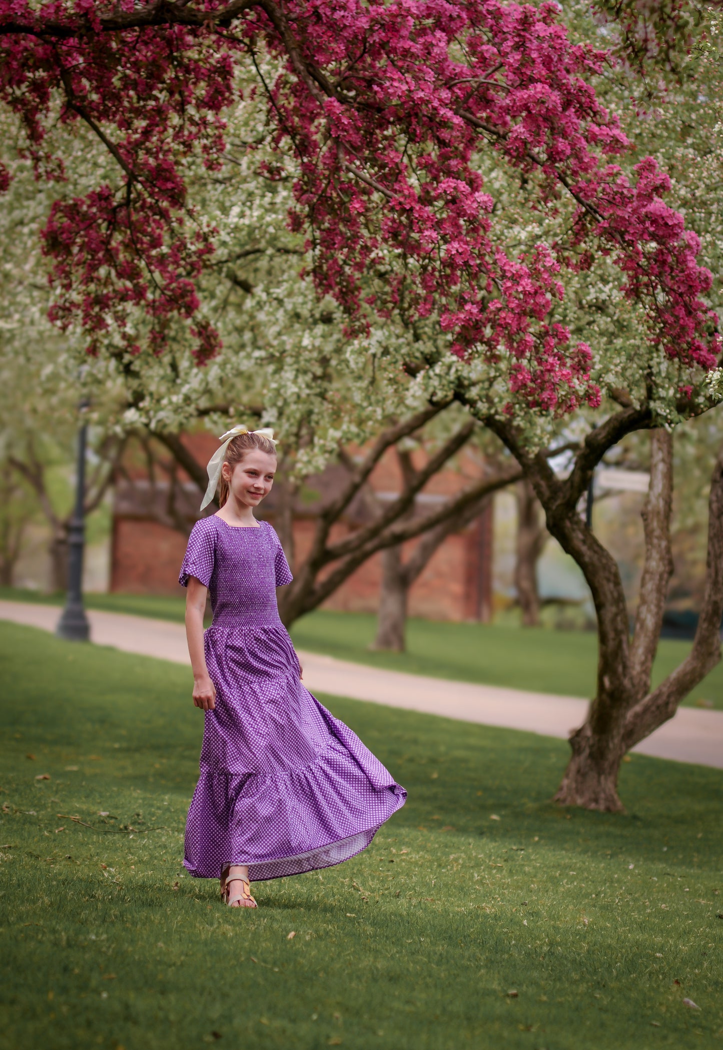 Young girl wearing a modest purple dress