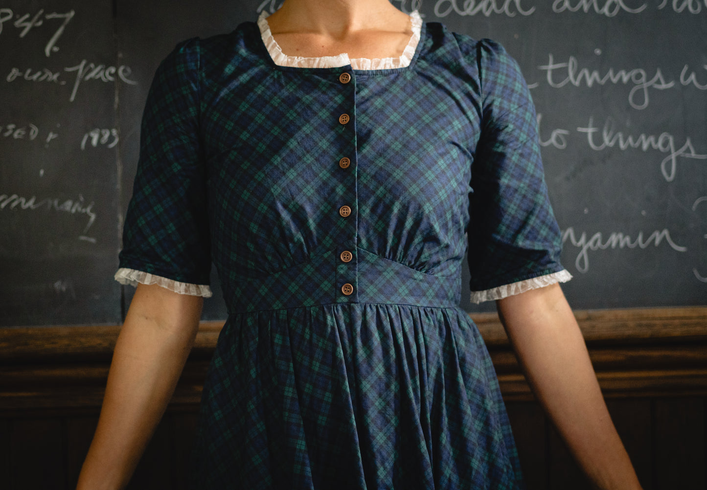 woman wearing a modest nursing blue patterned dress