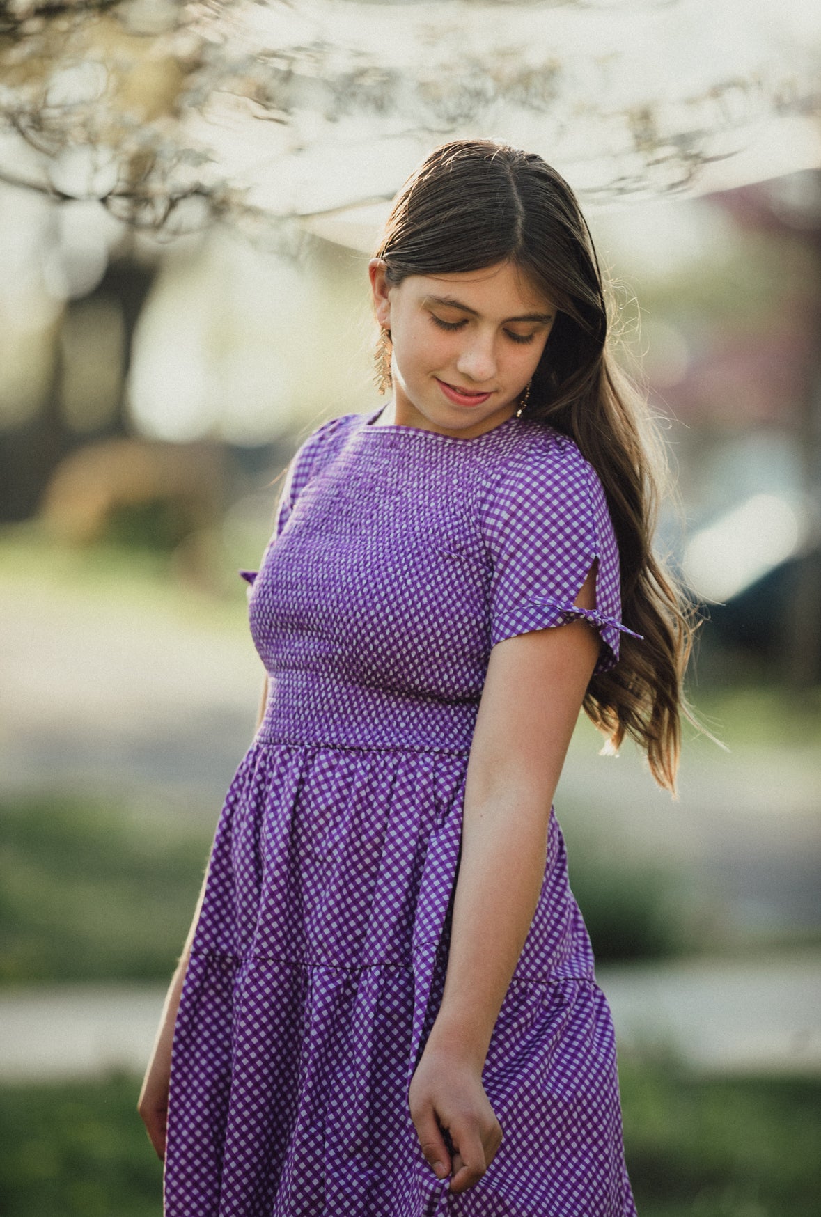Young girl wearing a modest purple dress